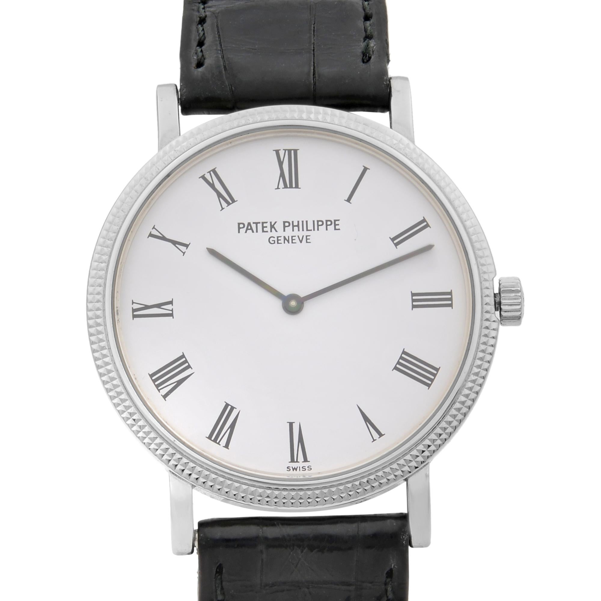 This pre-owned Patek Philippe Calatrava 5120G-001 is a beautiful men's timepiece that is powered by mechanical (automatic) movement which is cased in a white gold case. It has a round shape face, no features dial and has hand roman numerals style