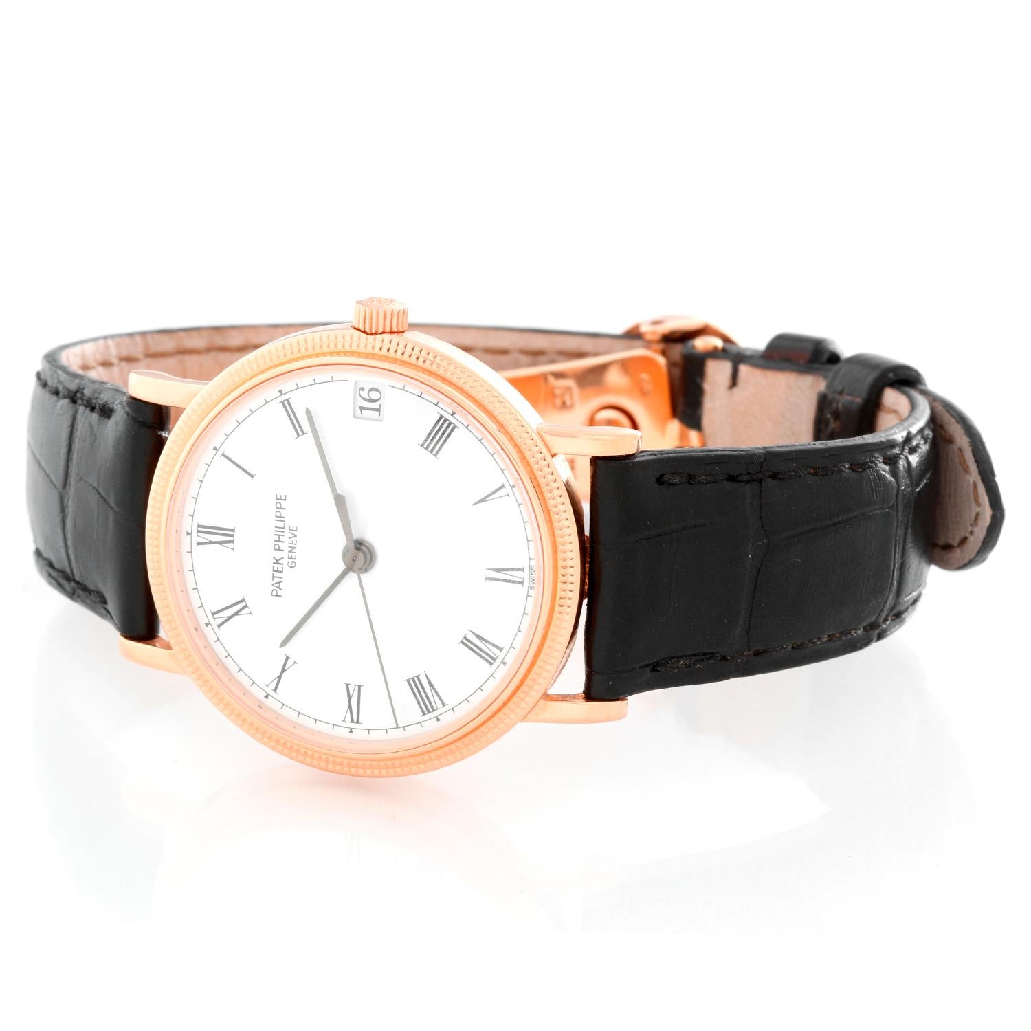 Patek Philippe Calatrava 18k Men's Watch  3802 - R (or 3802R; 3802/200) - Automatic winding. 18k rose gold case with hobnail bezel (33mm diameter). White dial with black Roman numerals; date at 3 o'clock. Strap band with 18k rose gold Patek Philippe