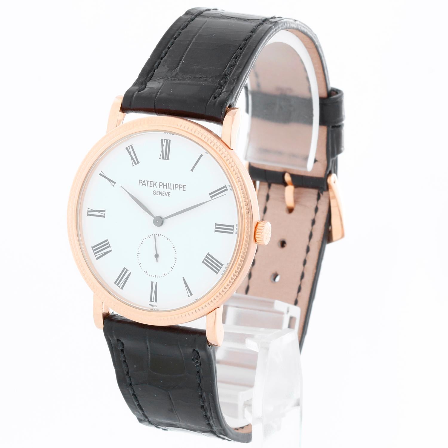 Patek Philippe Calatrava 18k Rose Gold Men's Watch  5119-R (or 5119R) - Manual winding. 18k rose gold case with hobnail bezel and exposition back (36mm diameter). White dial with black Roman numerals; subseconds at 6 o'clock. Patek Philippe strap