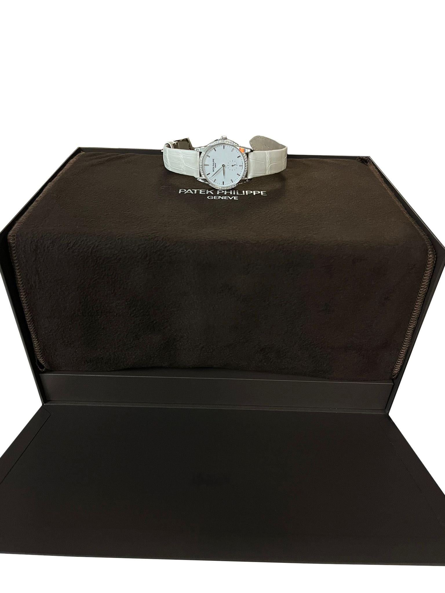 18kt white gold case with a white alligator leather strap. Fixed 18kt white gold 44 diamond-set bezel. White dial with white leaf-style shape hands and index hour markers. Minute markers around the outer rim. Dial Type: Analog. One - small seconds