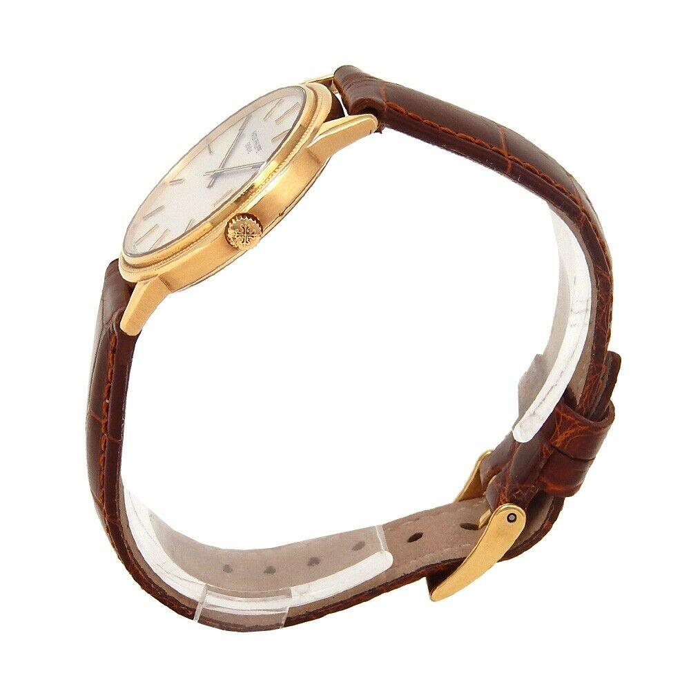 Brand: Patek Philippe
Band Color: Brown	
Gender:	Men's
Case Size: 32-35.5mm	
MPN: Does Not Apply
Lug Width: 18mm	
Features:	Date Indicator, Gold Bezel, Sapphire Crystal, Swiss Made, Swiss Movement
Style: Casual	
Movement: Mechanical (Automatic)
Age