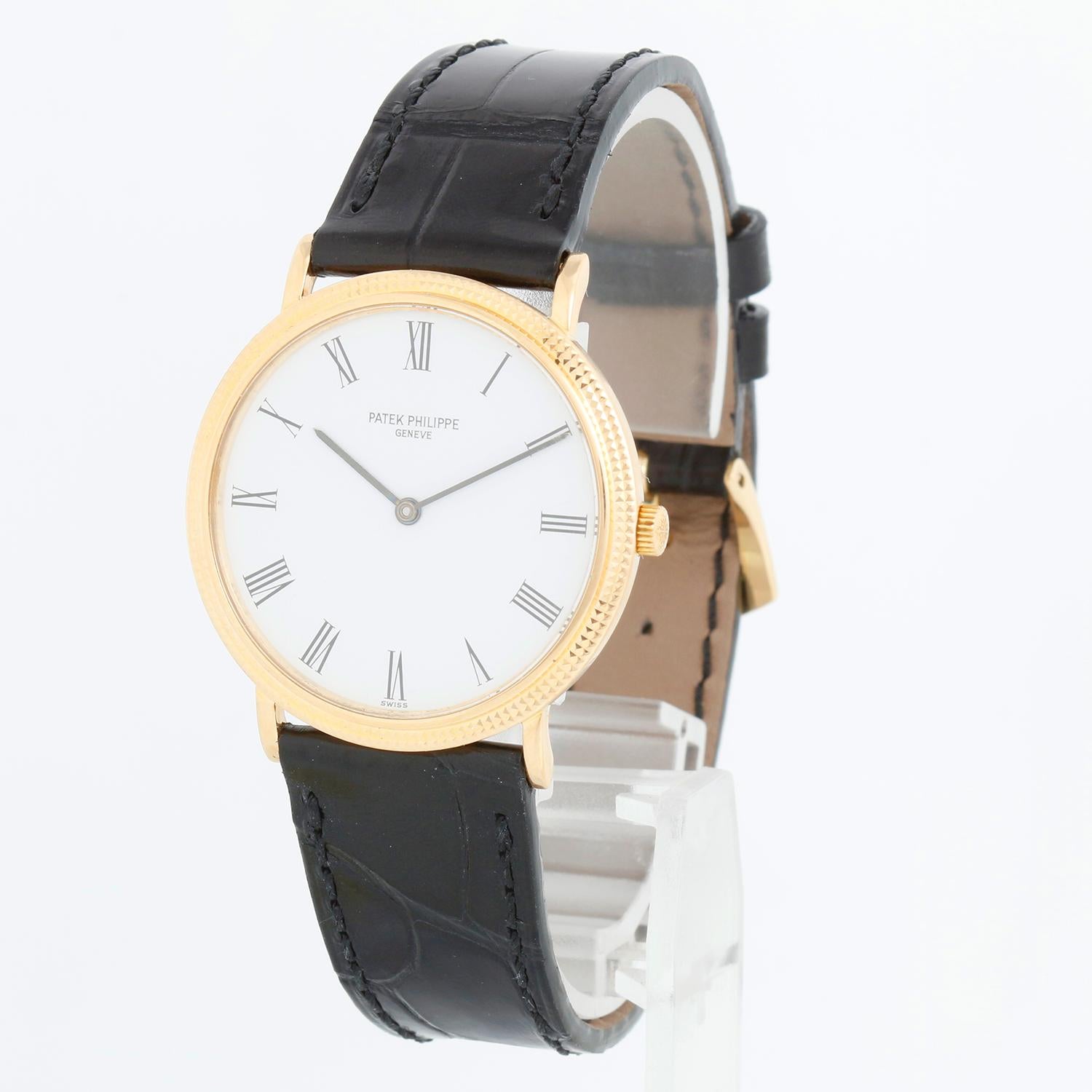 Patek Philippe Calatrava 18k Yellow Gold Men's Watch 3954 - Quartz . 18k yellow gold case with hobnail bezel (32mm diameter). White dial with roman numerals; dial has imperfections. Please refer to picture for it . Black Patek strap with Patek