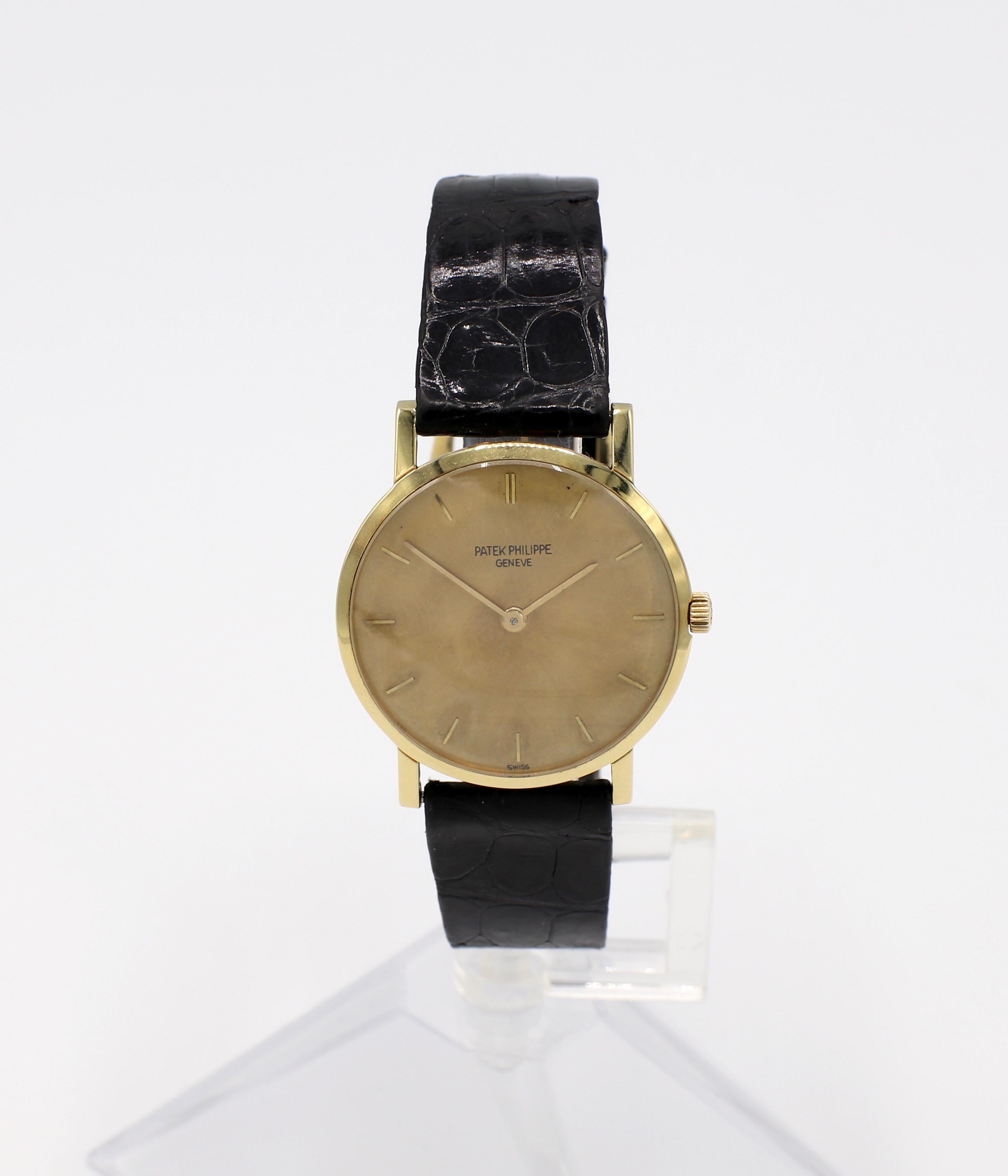 Patek Philippe Calatrava 18K Yellow Gold Reference 3470 

Metal: 18k yellow gold
Reference: 3470
Serial: 313***
Lugs: 16mm
Case: 30mm 
Width: 4.6mm 
Movement: Manual wind
Dial: Gold
Markers: Stick
Strap: Black leather crocodile. Strap is not Patek