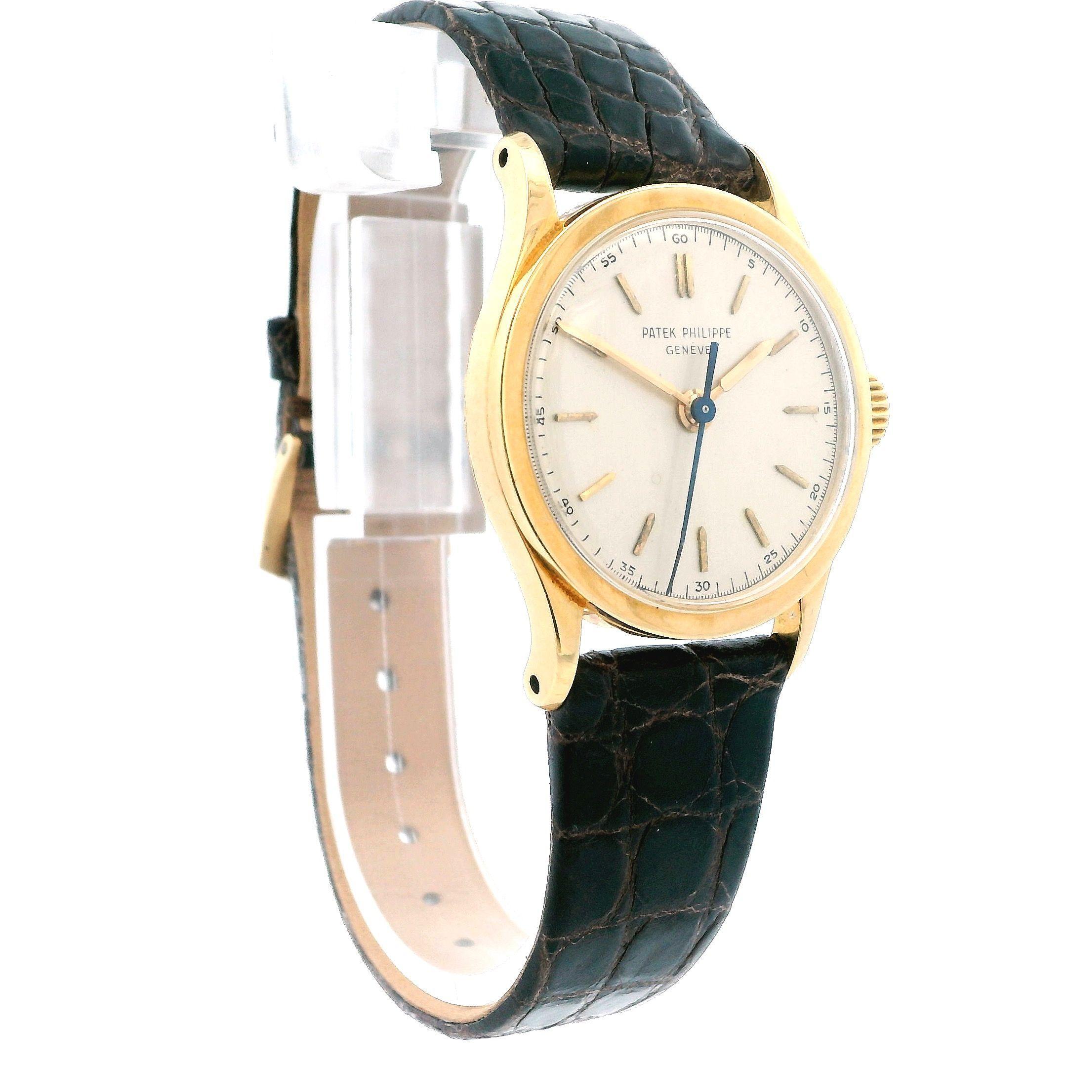 A classic Patek Philippe 2457 calatrava with original dial and sweep second featuring a round 30mm face with manual movement and contemporary Patek Philippe buckle watch, crafted in 18k gold. Created in 1950 in Switzerland.

Internal ID: W-18926