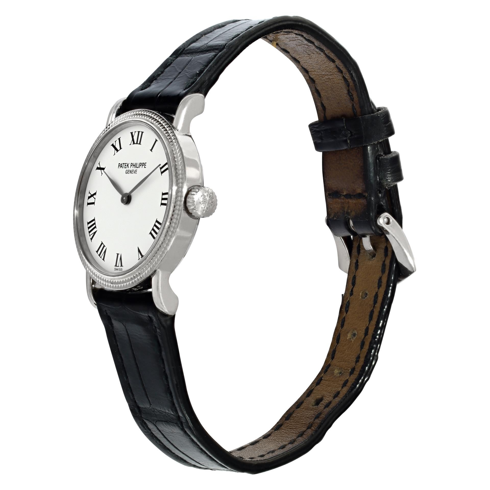 Ladies Patek Philippe Calatrava in 18k white gold on a black crocodile strap with an 18k white gold Patek Philippe tang buckle. Manual. 25 mm case size. Ref 4809G. Circa 2005. With original papers. Fine Pre-owned Patek Philippe Watch.

 Certified