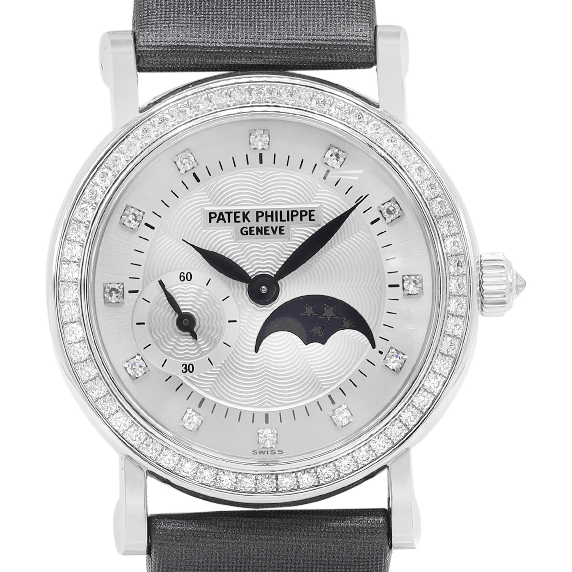 Display Model Patek Philippe Calatrava Moonphase 29mm White Gold Diamond Ladies Manual Winding Watch 4858G. The Watch is powered by a Mechanical (Manual Winding) Movement and Features: Polished 18k White Gold Round Case and Two-Piece Gray Nylon
