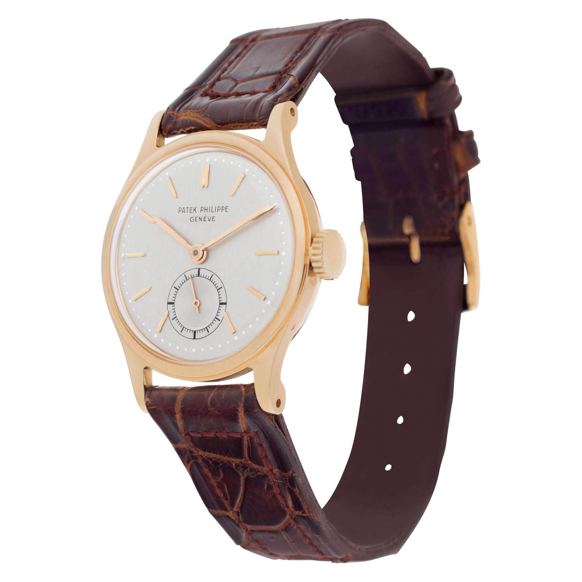 Patek Philippe Calatrava in 18k yellow gold on a brown alligator strap. Manual w/ subseconds. 30 mm case size. Ref 2451. Circa 1950s. Fine Pre-owned Patek Philippe Watch.

Certified preowned Dress Patek Philippe Calatrava 2451 watch is made out of