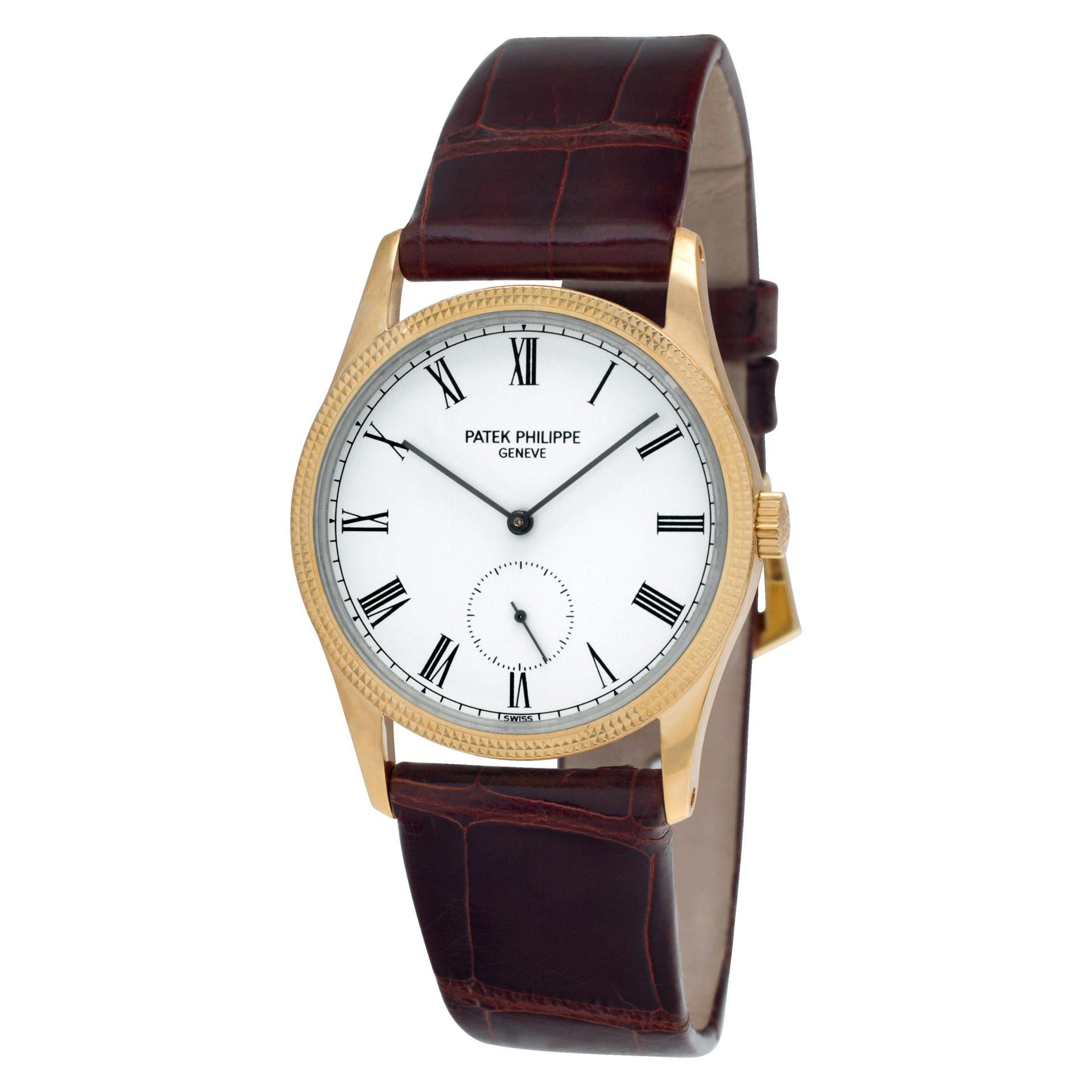 Patek Philippe Calatrava in 18k yellow gold with hobnail bezel on leather strap with PP tang buckle. Manual w/ subseconds. With Archive papers. 30 mm case size. Ref 3796D. Circa 1993. Fine Pre-owned Patek Philippe Watch. Certified preowned Dress
