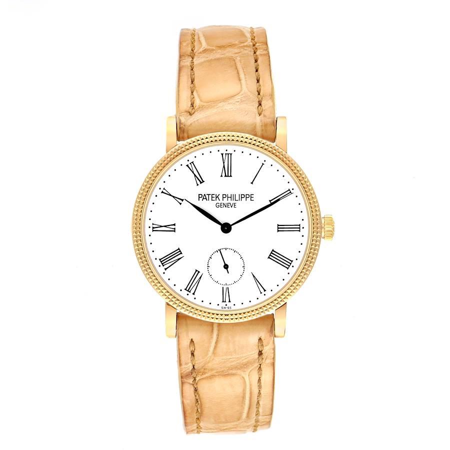 Patek Philippe Calatrava 31mm Yellow Gold Beige Strap Ladies Watch 7119. Manual winding movement. 18k yellow gold case 31.0 mm in diameter. Exhibition sapphire crystal case back. 18k yellow gold hobnail decorated bezel. Scratch resistant sapphire