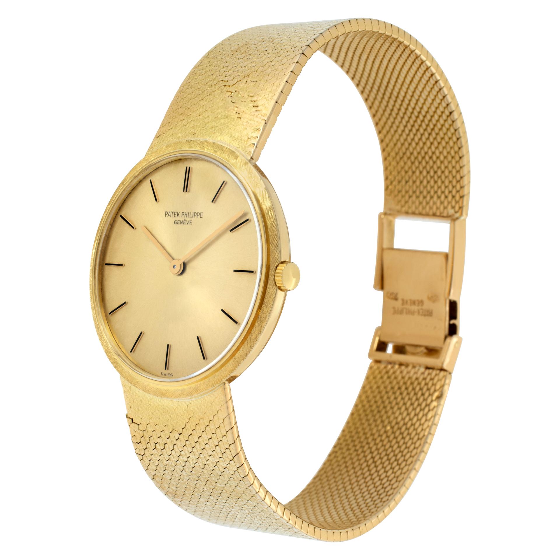 Patek Philippe Calatrava in 18k yellow gold on an 18k mesh bracelet. Manual wind. 32 mm case size. Will fit a 7.25 to 7.5  inch wrist. Ref 3520. Fine Pre-owned Patek Philippe Watch. Certified preowned Vintage Patek Philippe Calatrava 3520 watch is