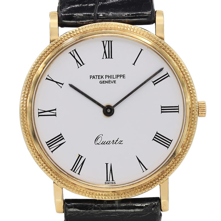Pre-owned Patek Philippe Calatrava 33mm 18k Gold White Dial Men's Quartz Watch 3744J.  Watch Dial have Rust on the center Pinion and some Discoloration on the hands. The Watch is powered by a Quartz Movement and Features:18k Yellow Gold Round Case
