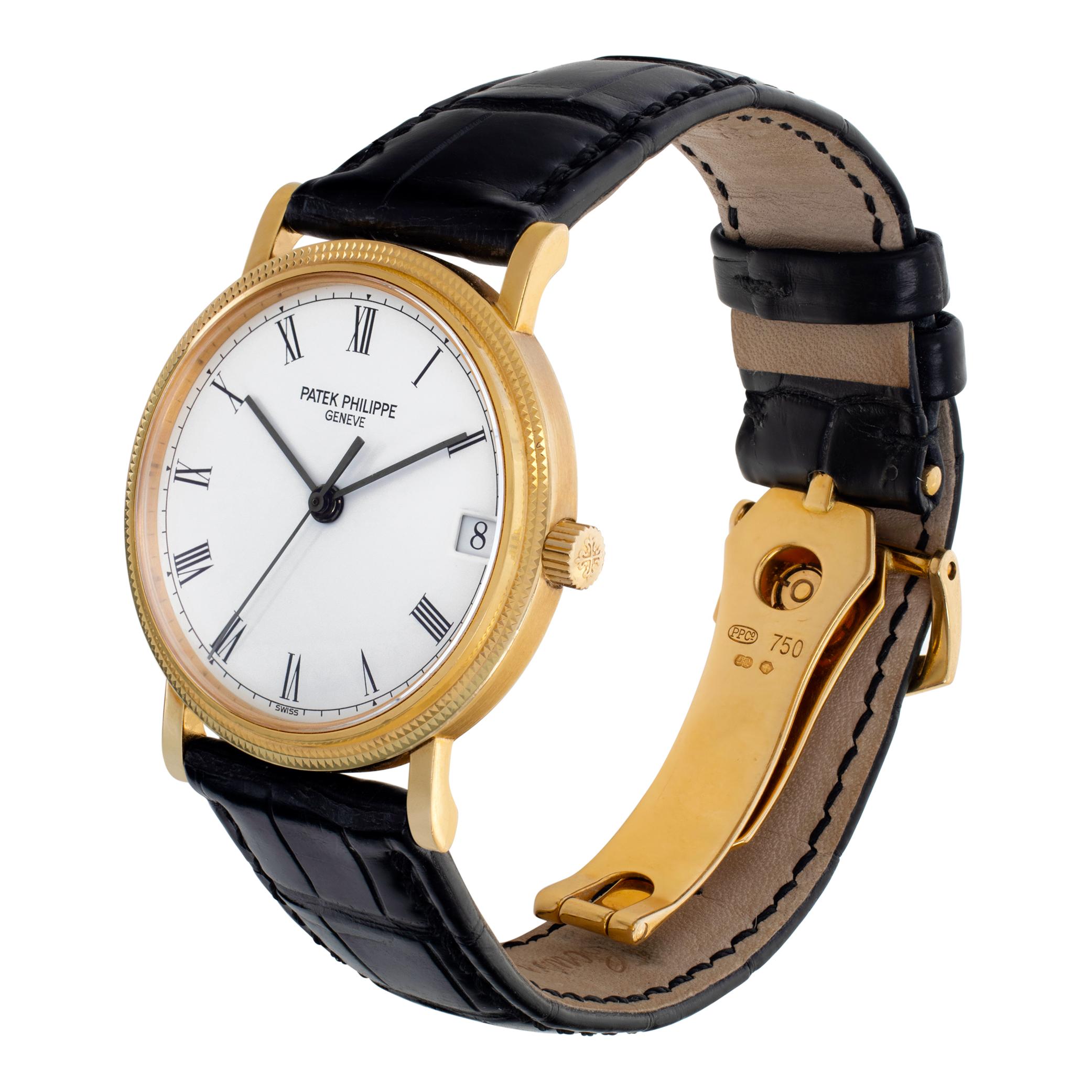 Patek Philippe Calatrava 3802 in 18k yellow gold on a black alligator strap with 18k deployant buckle. Auto w/ sweep seconds and date. 33 mm case size. Ref 3802/200. Fine Pre-owned Patek Philippe Watch.

 Certified preowned Classic Patek Philippe