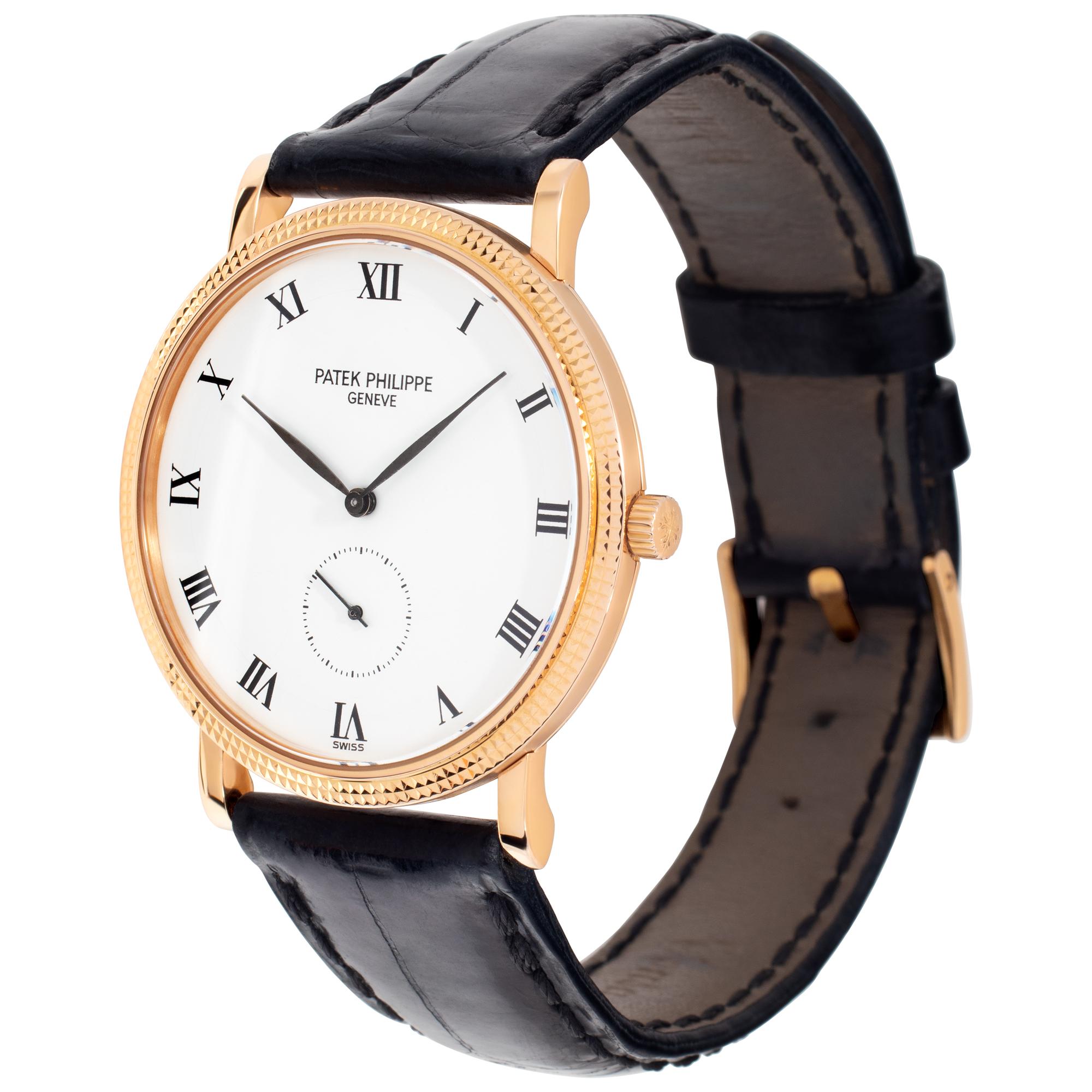 Patek Philippe Calatrava in 18k yellow gold with hobnail bezel on a black alligator strap with 18k tang buckle. Manual w/ subseconds. 33 mm case size. Ref 3919. Fine Pre-owned Patek Philippe Watch. Certified preowned Classic Patek Philippe Calatrava
