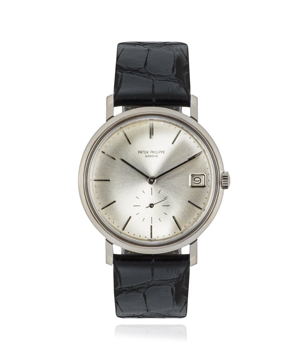 A 35mm Calatrava in white gold by Patek Philippe. Features a silver dial with a date aperture, a small seconds sub dial and a fixed white gold bezel. Fitted with a plexiglass, an automatic movement and a generic black leather strap equipped with a