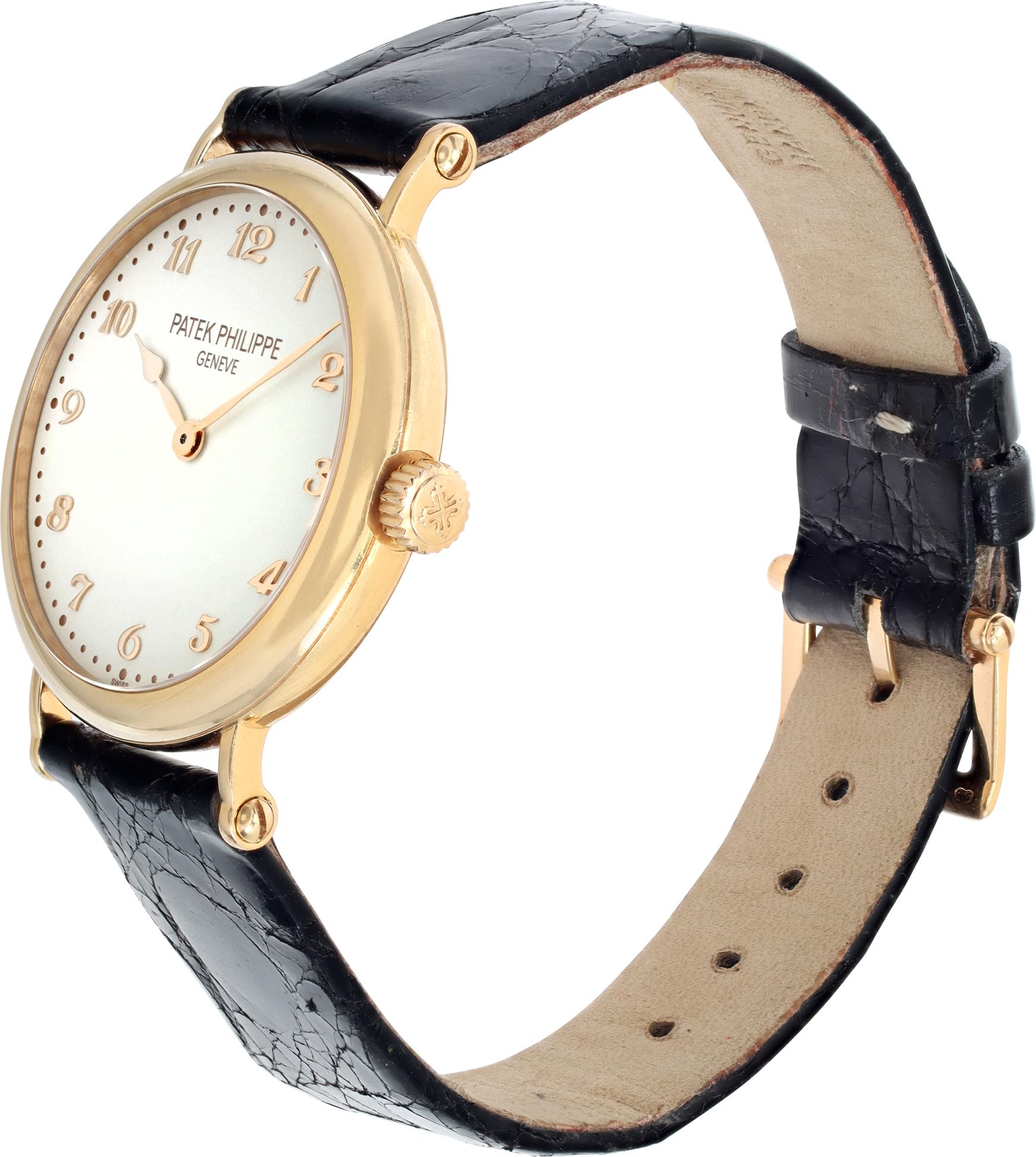 Patek Philippe Calatrava in 18k yellow gold on an crocodile strap with tang buckle. Automatic movement under glass. 34 mm case size. Ref 7200r. Fine Pre-owned Patek Philippe Watch.

 Certified preowned Classic Patek Philippe Calatrava 7200r watch is