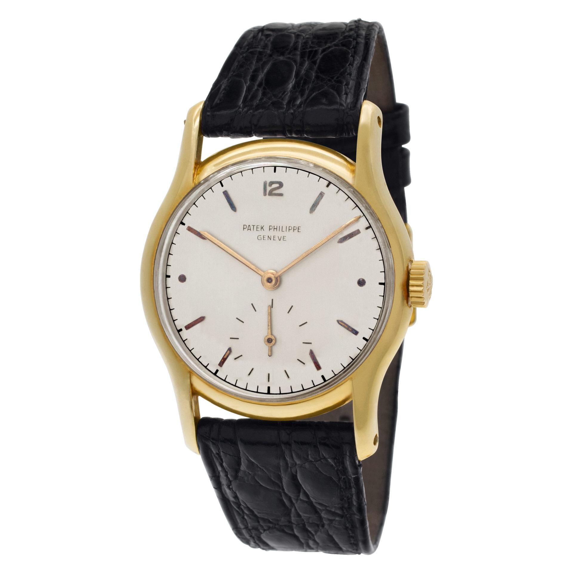 Vintage Patek Philippe Calatrava in 18k an einem Krokodilband. Manuell mit Untersekunden. Verlängerte Laschen. Mit Archivunterlagen. Ref 2406. Ca. 1948. Fein Pre-owned Patek Philippe Uhr.  Zertifizierte Preowned Vintage Patek Philippe Calatrava 2406