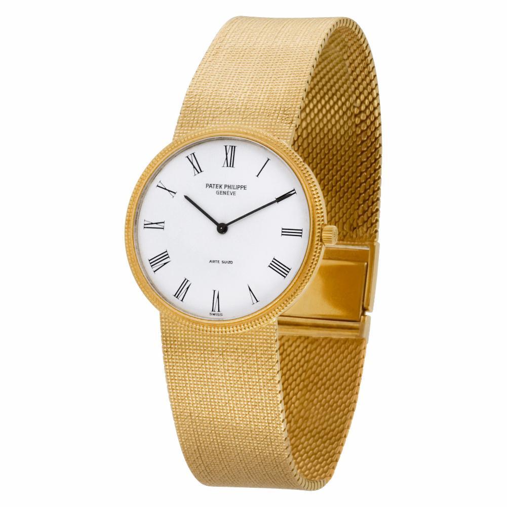 Patek Philippe Calatrava Reference #:3520DJ-001. Patek Philippe Hobnail Bezel Calatrava in 18k yellow gold on a 18k yellow gold mesh bracelet signed DA (DE AGUSTINO ), Manual movement.. Comes with Archive papers. 32 mm case size. Ref 3520. 7.75
