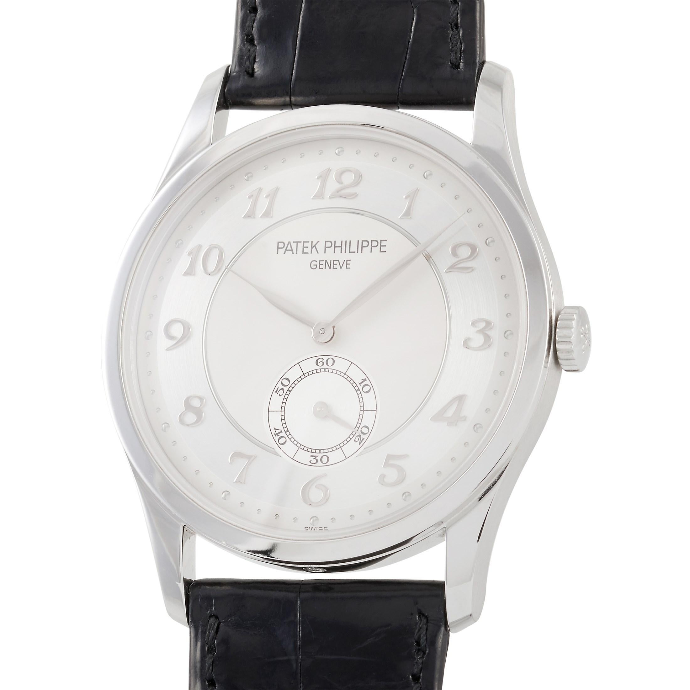 This Patek Phillipe Calatrava 37 mm Platinum Watch, reference number 5196P-001, comes with a platinum case that measures 37 mm in diameter. The case is presented on black leather strap with tang clasp. The white dial displays hours, minutes, and