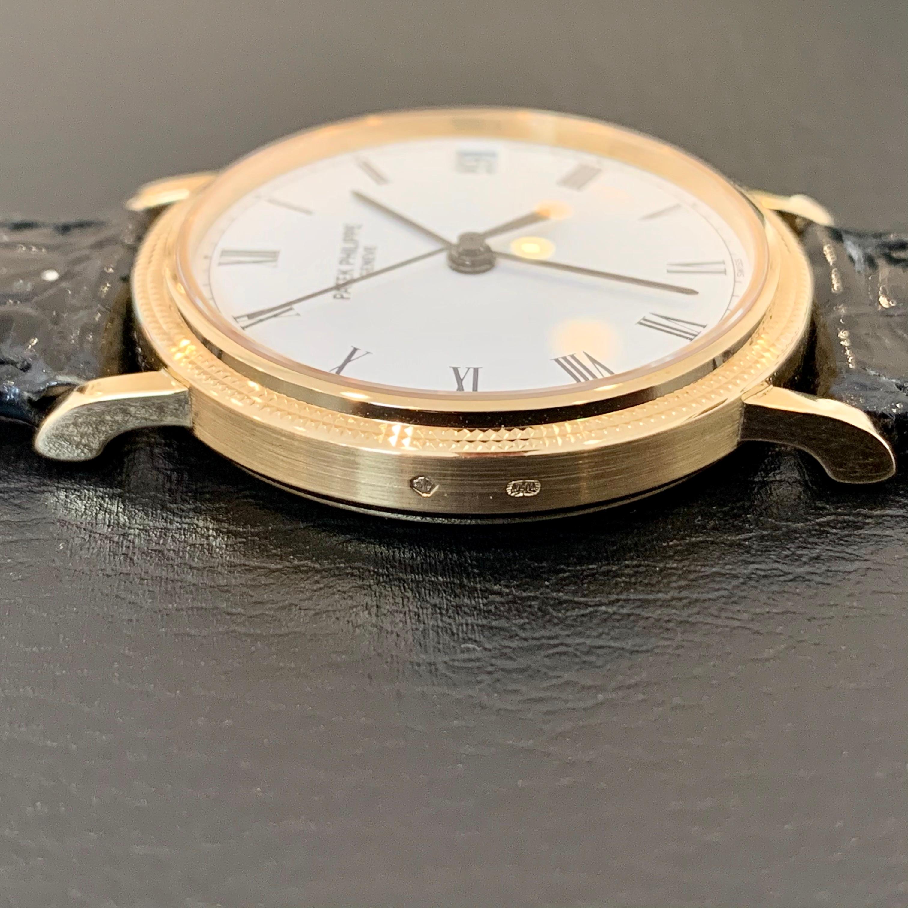 Elegant 18K Gold watch by Patek Philippe. Calatrava 3802. Original papers included. Mens. Automatice. Self-wind. Original band, stamped Patek Philippe on backside of leather. Near mint condition as shown in photos. Originally purchased circa 2002. 