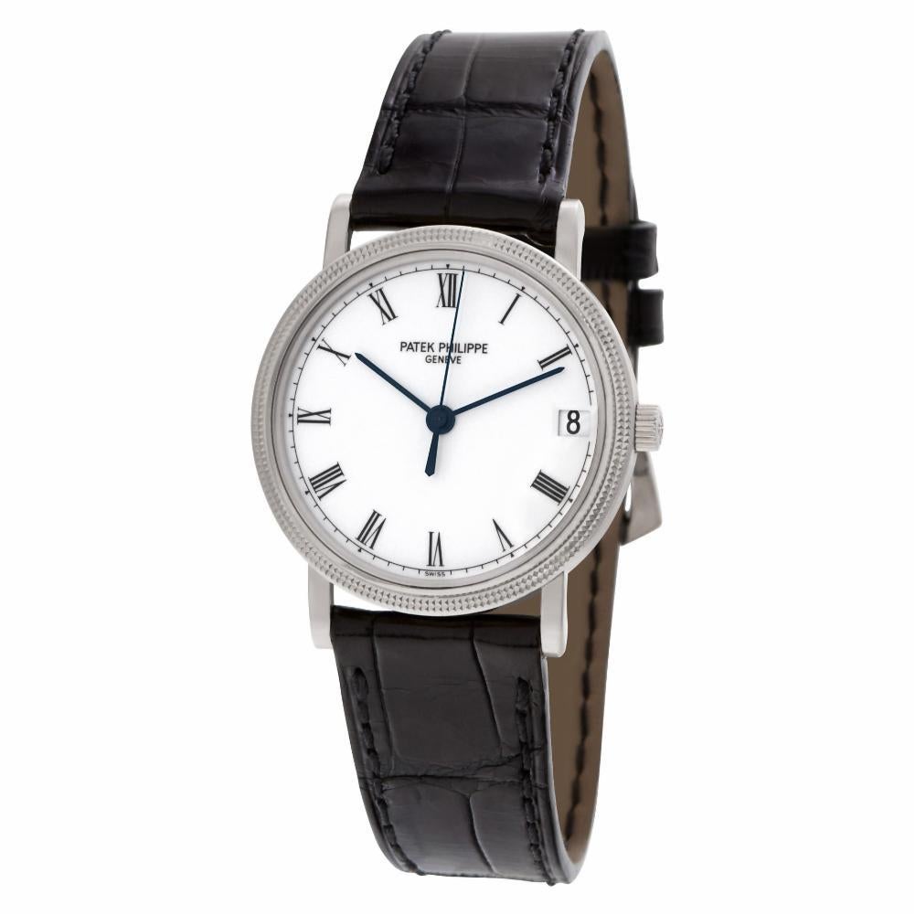Patek Philippe Calatrava in 18k white gold with white dial and roman numerals on PP leather strap with 18k tang buckle. Auto w/ sweep seconds and date. 33 mm case size. Ref 3802/200. Archive papers. Circa 2002. Fine Pre-owned Patek Philippe Watch.