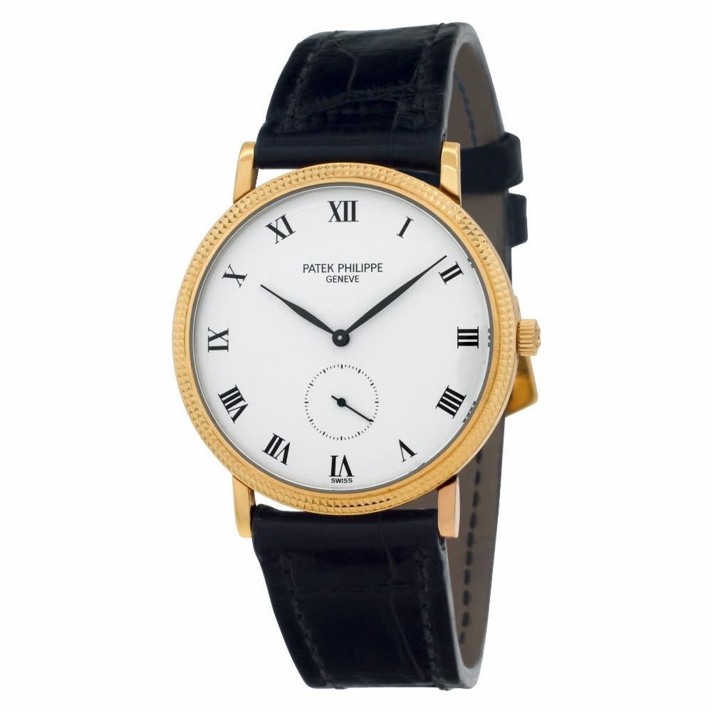 Patek Philippe Calatrava in 18k yellow gold on an . Manual w/ subseconds. With papers. Ref 3919. Circa 1989. Fine Pre-owned Patek Philippe Watch. Certified preowned Classic Patek Philippe Calatrava 3919 watch is made out of yellow gold on a Black