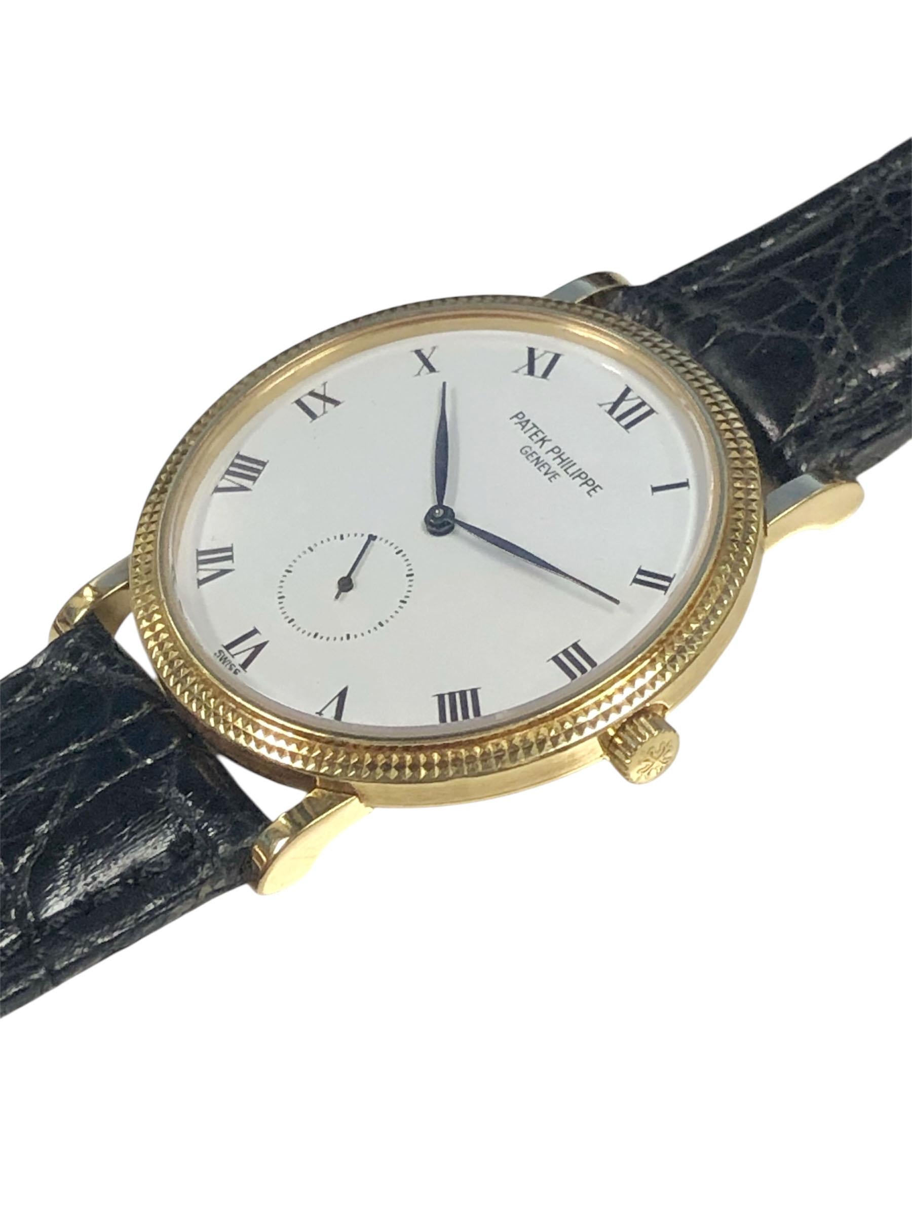 Circa 1989 Patek Philippe ref. 3919 Calatrava one owner complete set Wrist Watch. 33 M.M. 18k Yellow Gold 2 piece case with Iconic Hobnail Bezel. Caliber 215, 18 Jewel Mechanical, Manual wind movement. White Enamel Porcelain dial with Black Roman