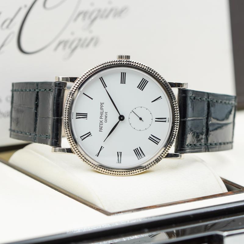 This Patek Philippe Calatrava was recently added to our collection and is in excellent condition. The watches round case is made of white gold and measures 36mm. This model has a white dial and a small seconds sub-dial at the 6 o'clock position. The