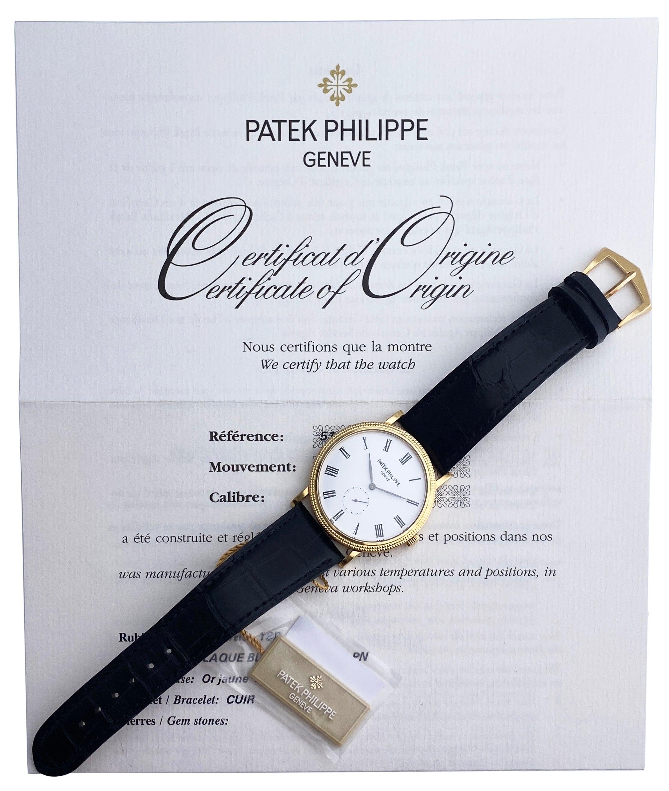 Patek Philippe Calatrava 5119J-001 Mens Watch. 36mm 18K yellow gold case with Hobnail patterned bezel. White dial with black steel hands and Roman numeral hour markers. Small second sub-dial. Black Leather strap with 18K yellow gold buckle. Will fit