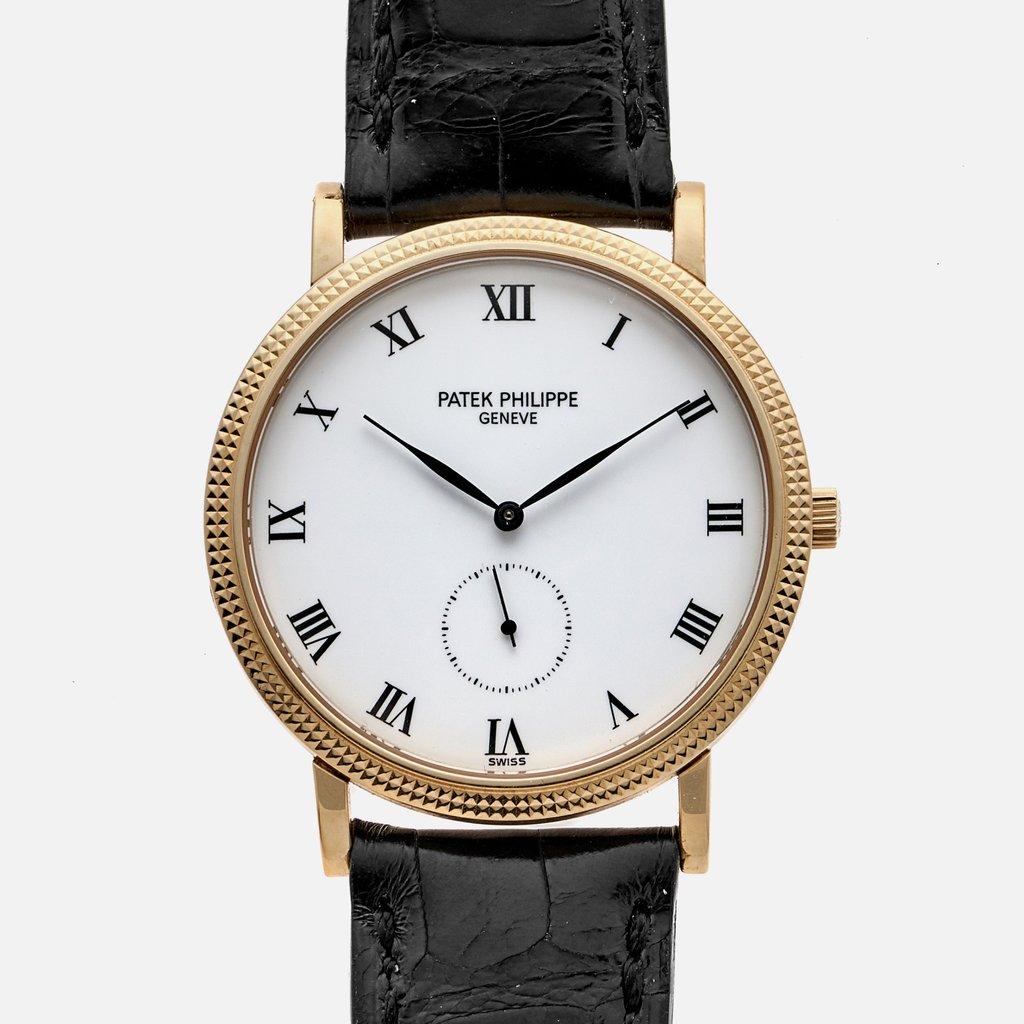 Patek Philippe Calatrava watch is made out of yellow gold on a Black Alligator strap with a 18k tang buckle. 

The movement inside is a beautifully finished manual-winding ticking away at 28,800 beats per hour.

With original box.