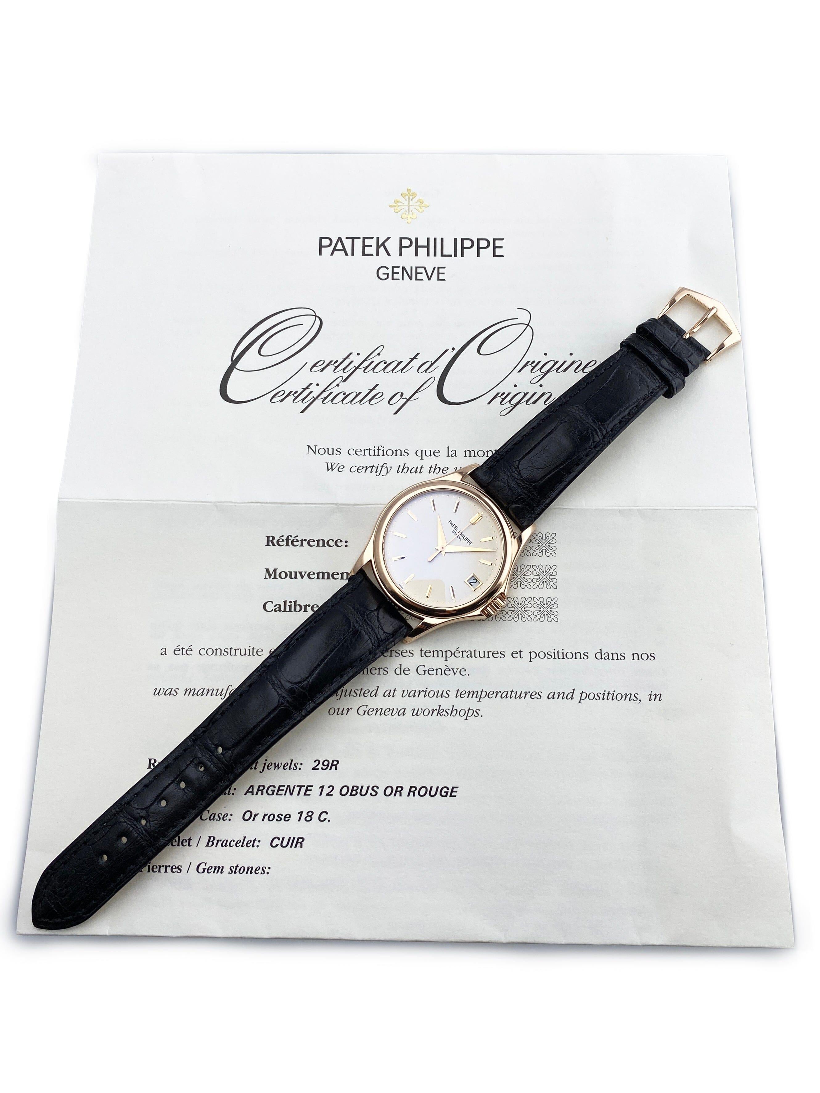 Patek Philippe Calatrava 5127R-001 Orologio da Uomo. Cassa in oro rosa 18 carati da 37 mm. Lunetta levigata in oro rosa 18 carati. Quadrante argento con lancette e indici in oro rosa. La data viene visualizzata a ore 3. Indicatore dei minuti sul
