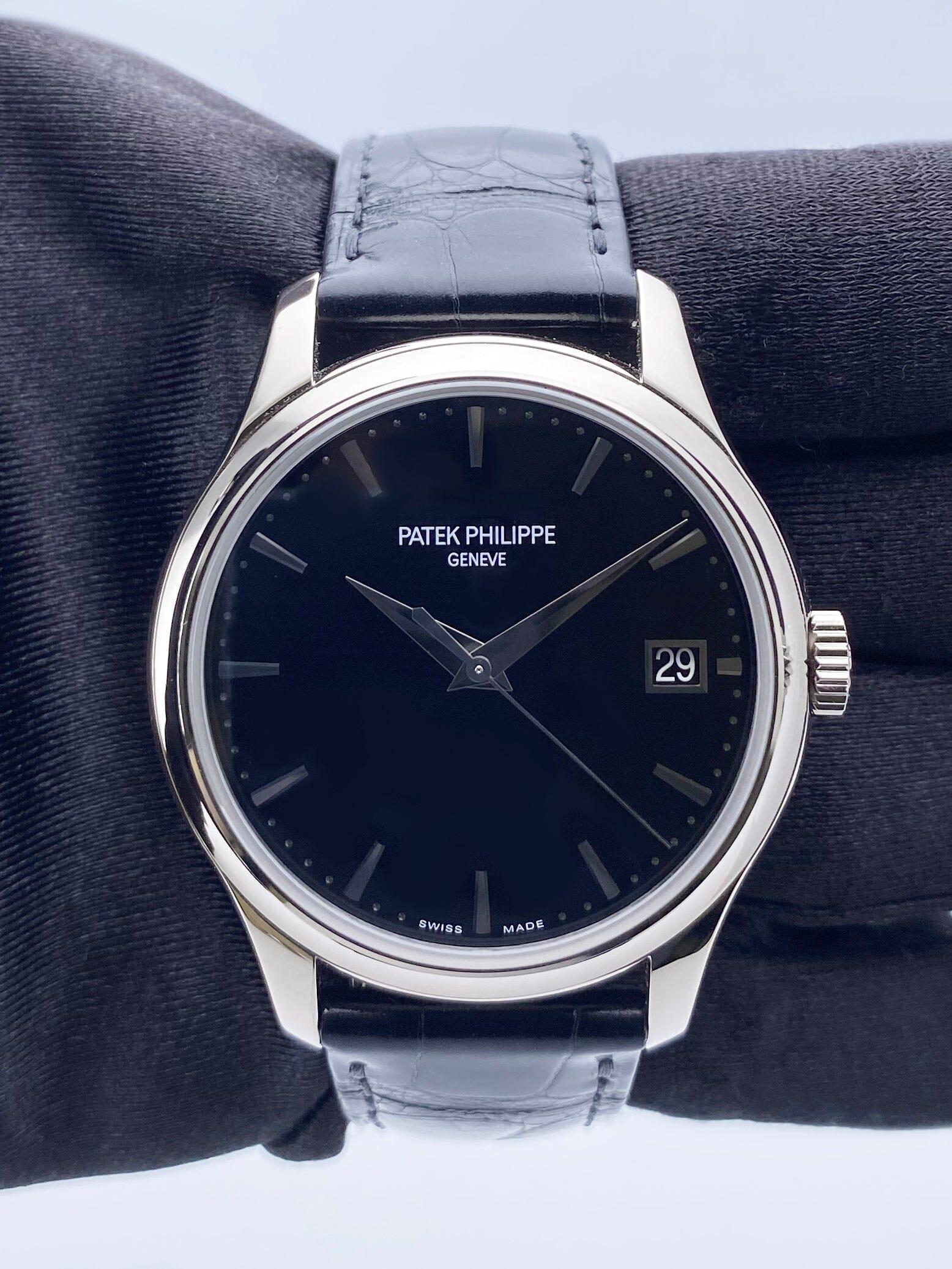 Patek Philippe Calatrava 5227G-010 Mens Watch. 39mm 18K white gold case. 18K white gold bezel. Black lacquered dial with white gold hands and index hour markers. The date is displayed at 3 o'clock position. Black leather strap with 18K white gold
