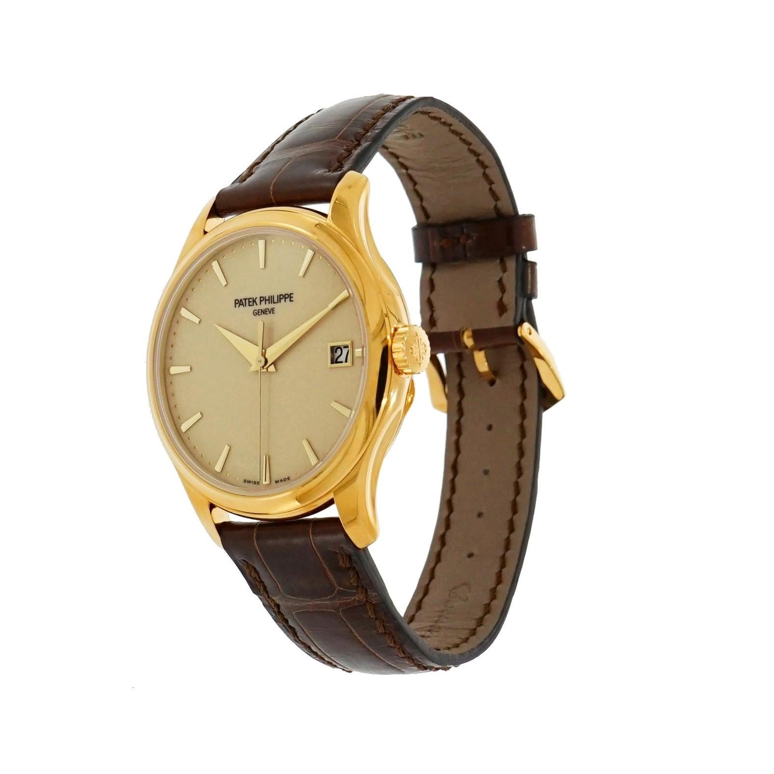 Pre-owned in excellent condition Patek Philippe Calatrava in 18m karat yellow gold 39 mm case, sleek lines and sophisticated elegance, ivory lacquered dial with gold applied trapeze shapped indexes hour markers, date aperture at 3 o’clock,  center