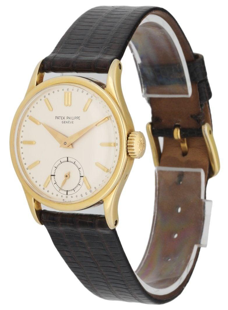 
Patek Philippe 96 Calatrava vintage men's watch. 31MM 18k yellow gold case. Silver-White dial with gold hands golden index hour marker. Small second subdial display between 5 & 7 o'clock position. Dark brown aftermarket leather strap