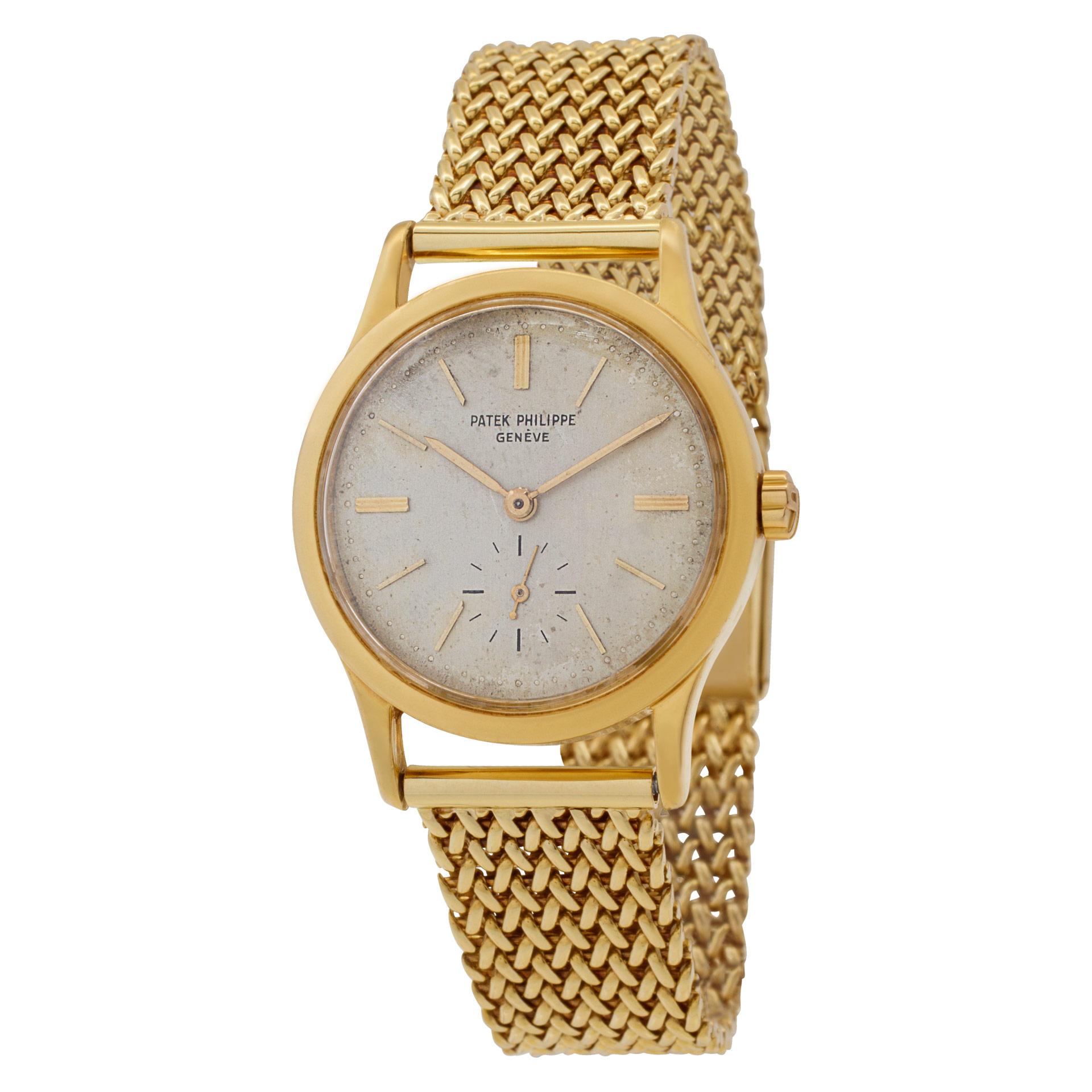 Vintage and rare Patek Philippe Calatrava in 18k on mesh custom 18k band, 30 jewels and gold applied sticks. Triangular lugs. Auto w/ subseconds. 32 mm case size. Will fit 7.75