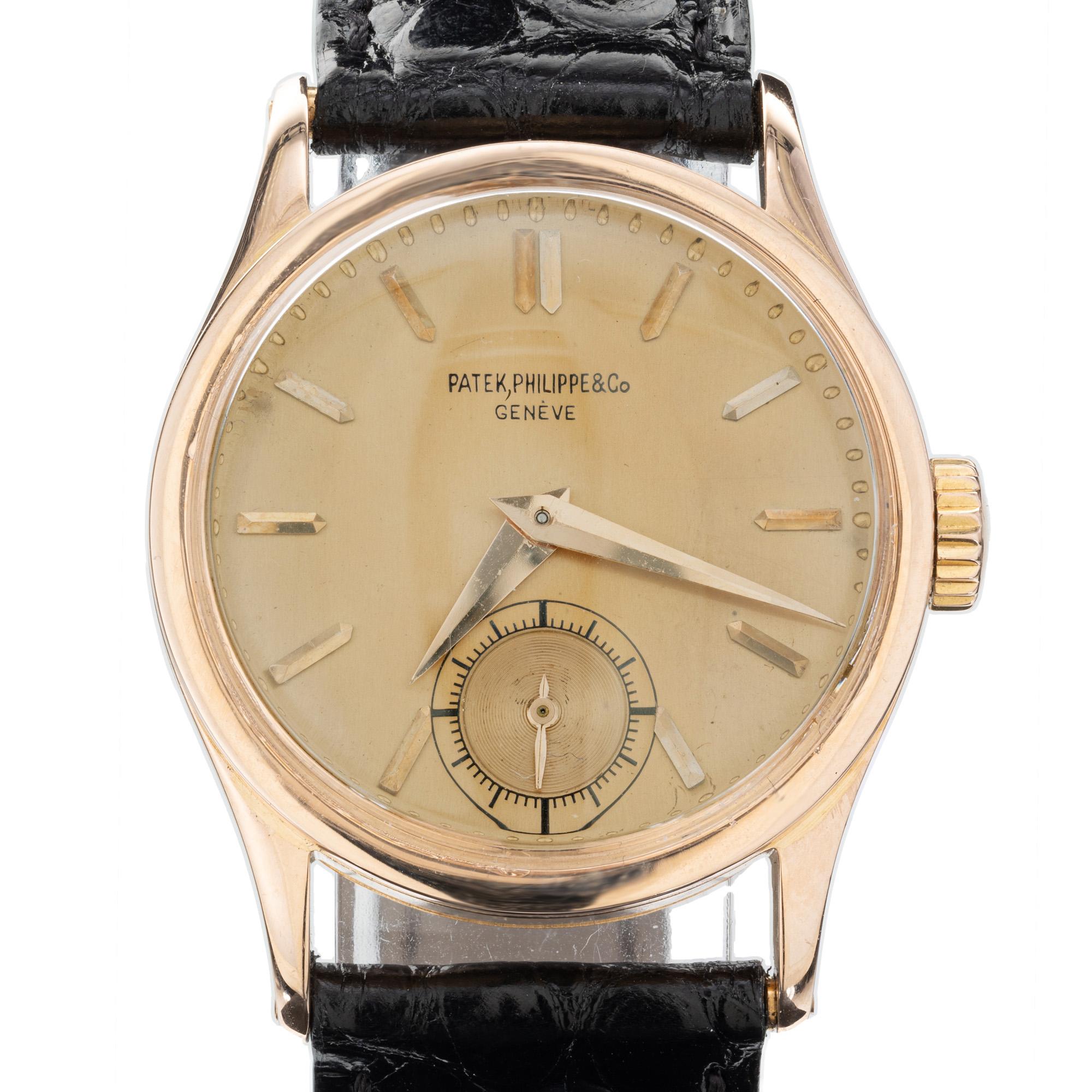 1960's Patek Philippe men's Calatrava wristwatch. 18k rose gold with gold markers. The buckle is a new 18k rose gold Patek buckle. Note: small dial stain at 10 o'clock. Fully serviced. 

Length: 38mm
Width: 30mm
Band width at case: 18mm
Case
