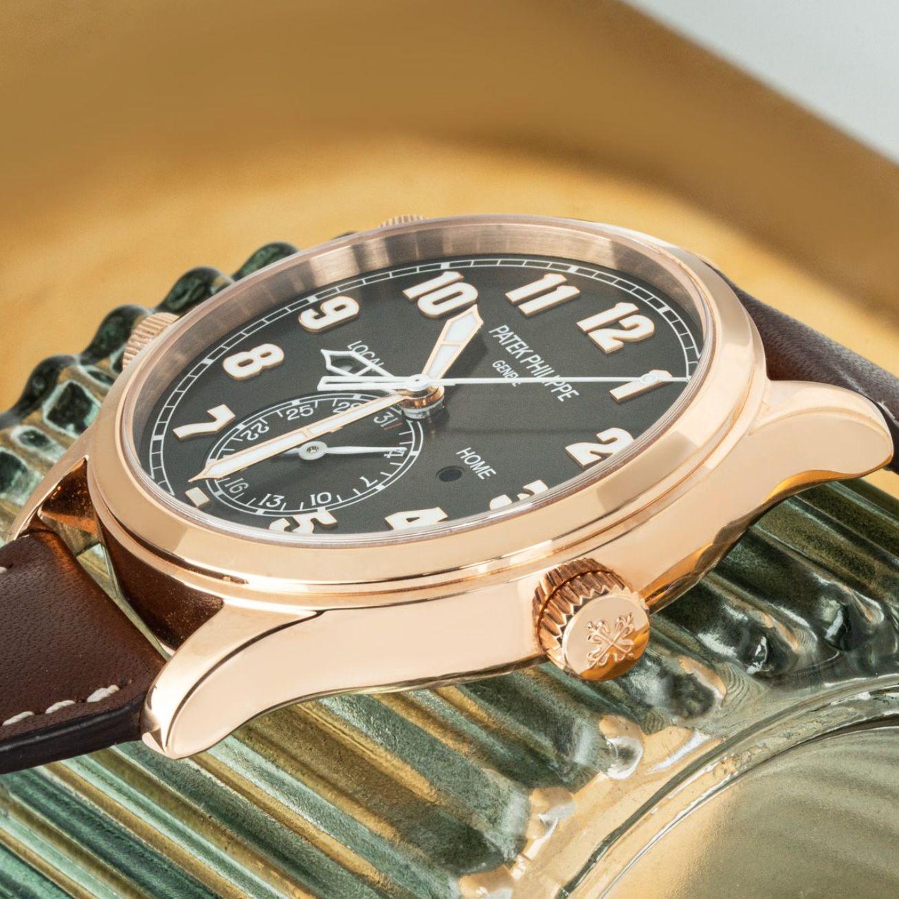A Complications Calatrava Pilot Travel Time, crafted in rose gold by Patek Philippe. Features a brown sunburst black gradated dial with a second-time zone hand, day/night indicators and date display.

The Patek Philippe brown leather strap comes
