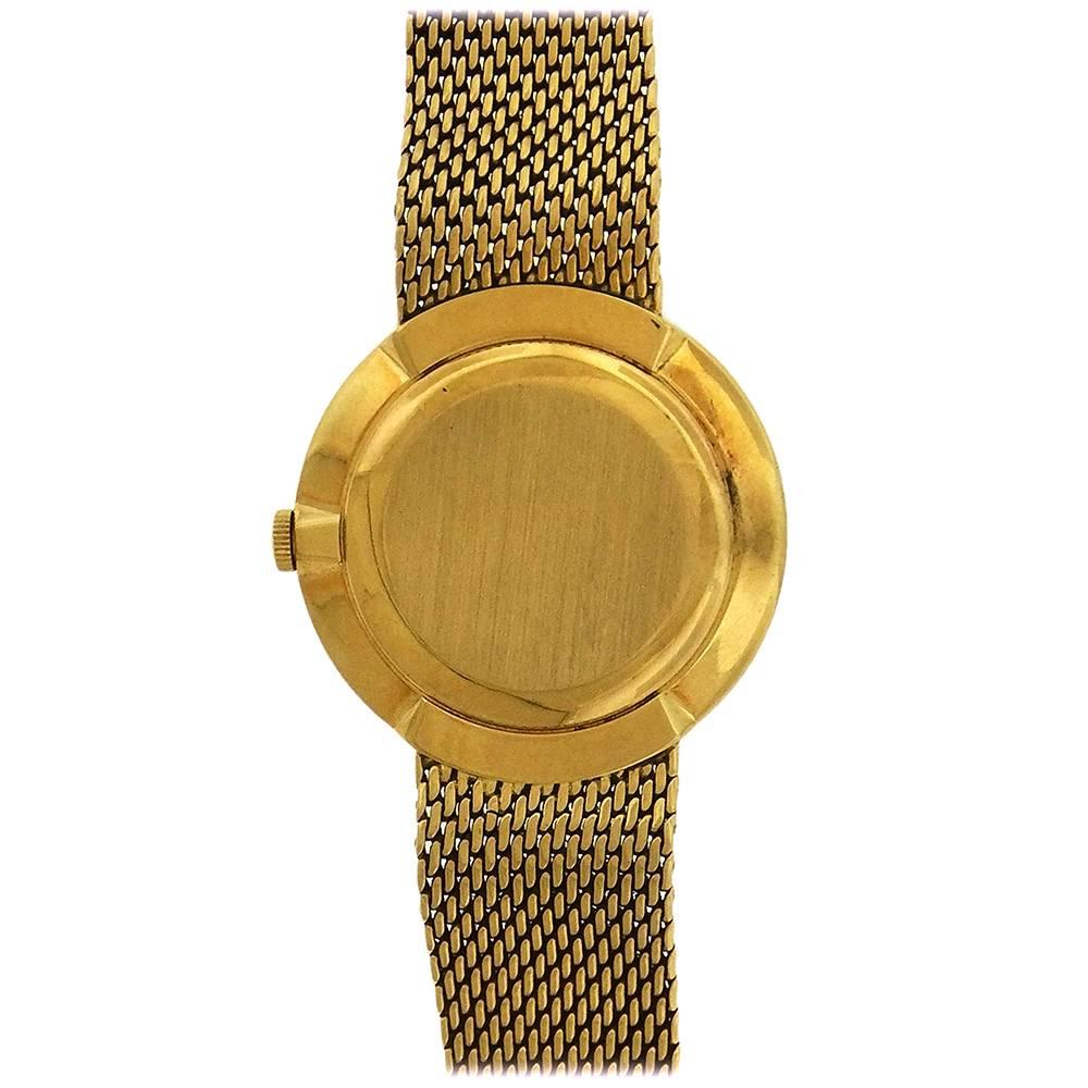 18k yellow gold Patek Philippe Ref. 3562/1 so-called IOS Presentation bracelet watch, circa 1969. The 33mm thin case has a solid back, rounded bezel, hooded lugs, integrated chainmail bracelet, 9-1/2