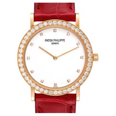 Patek Philippe Calatrava Montre en or rose, cadran argenté et diamants 5006 papiers