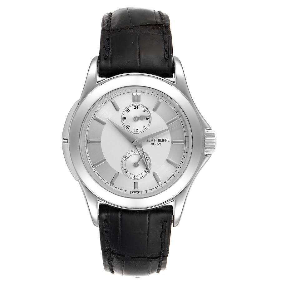 Patek Philippe Calatrava Travel Time Platinum Mens Watch 5134. Manual winding movement. Platinum case 37.0 mm in diameter. Crown with protective shoulders, pusher at 10 and 8 o'clock to change time zone, screw-down sapphire crystal case back.