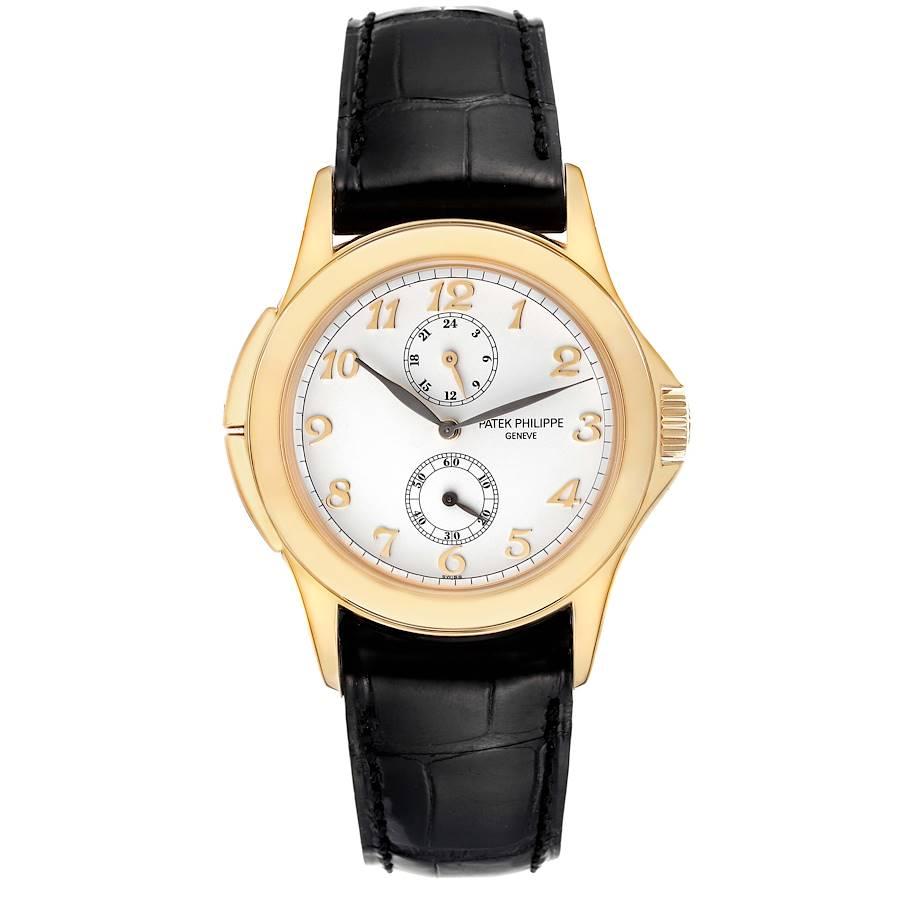 Patek Philippe Calatrava Travel Time Yellow Gold Mens Watch 5134. Manual winding movement. 18k yellow gold case 37.0 mm in diameter. Crown with protective shoulders, pusher at 10 and 8 o'clock to change time zone, screw-down sapphire crystal case