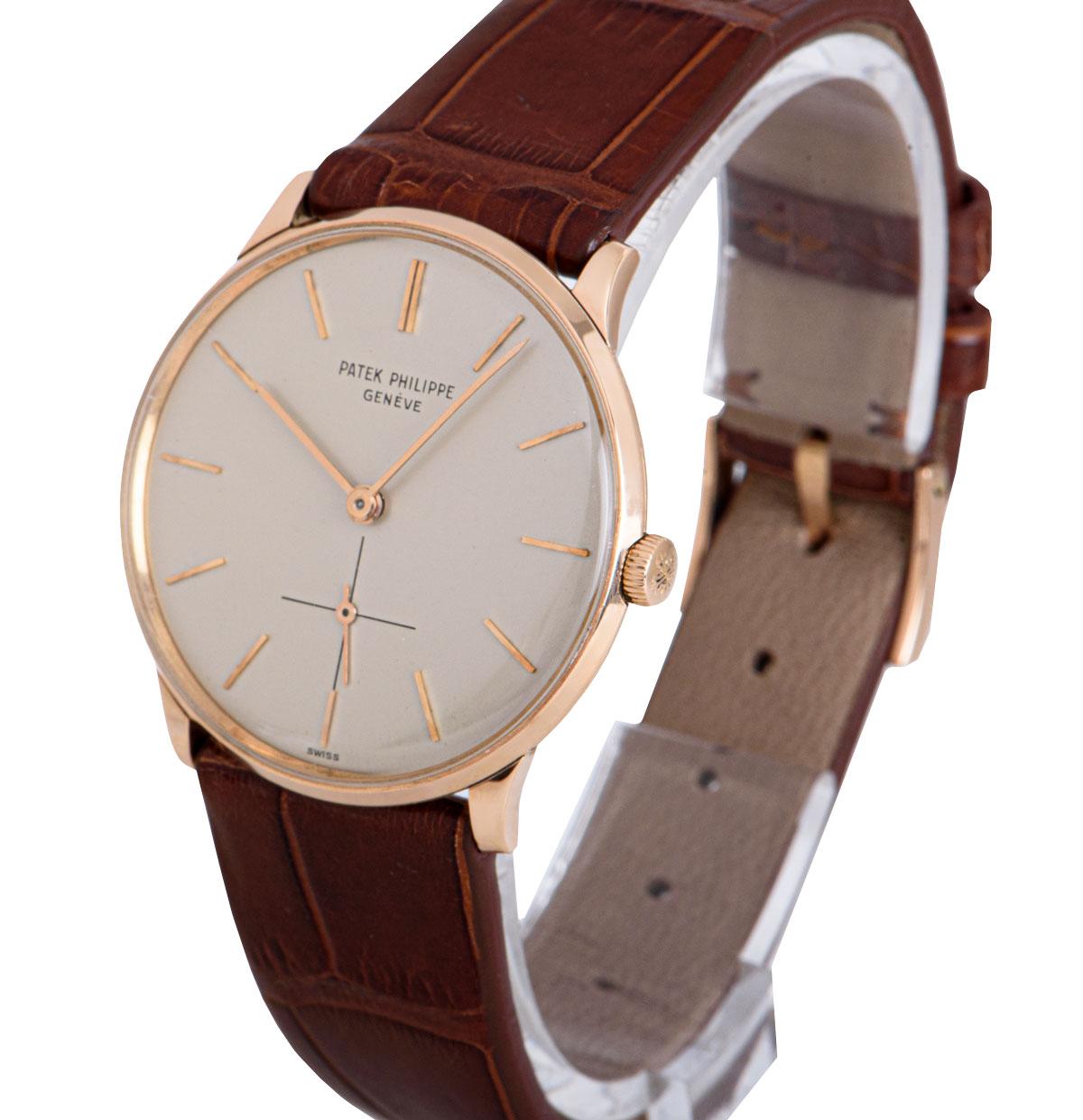 A 33 mm 18k Rose Gold Calatrava Vintage Gents Wristwatch, silver dial with applied hour markers, a fixed 18k rose gold bezel, a brown leather strap (not by Patek Philippe) with an original 18k rose gold pin buckle, plastic glass, manual wind