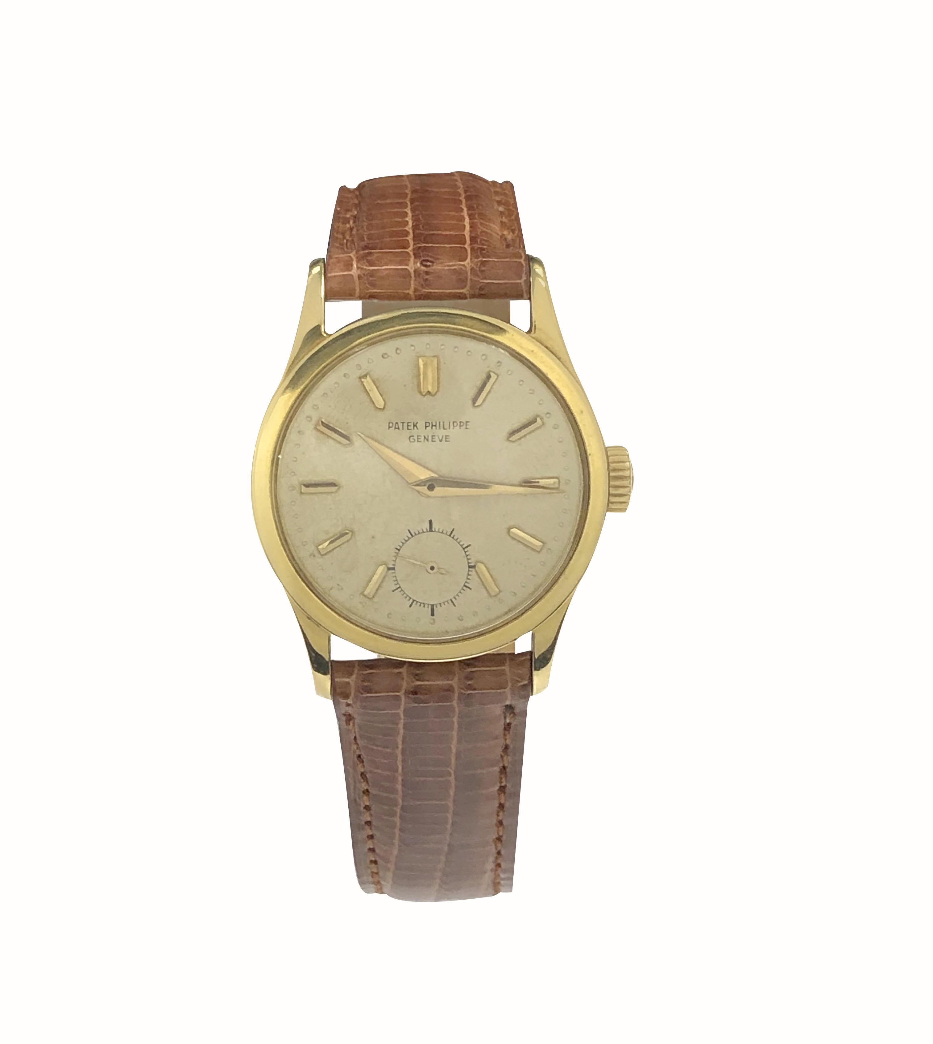 Circa 1950s Patek Philippe Calatrava Reference 2545, 32 M.M. 18K yellow Gold 2 piece case with Water Proof Back, 18 Jewel, Caliber  12-400 Mechanical, Manual wind nickle Lever movement, Patek Philippe Logo Crown.  Silver Satin Dial with Raised Gold