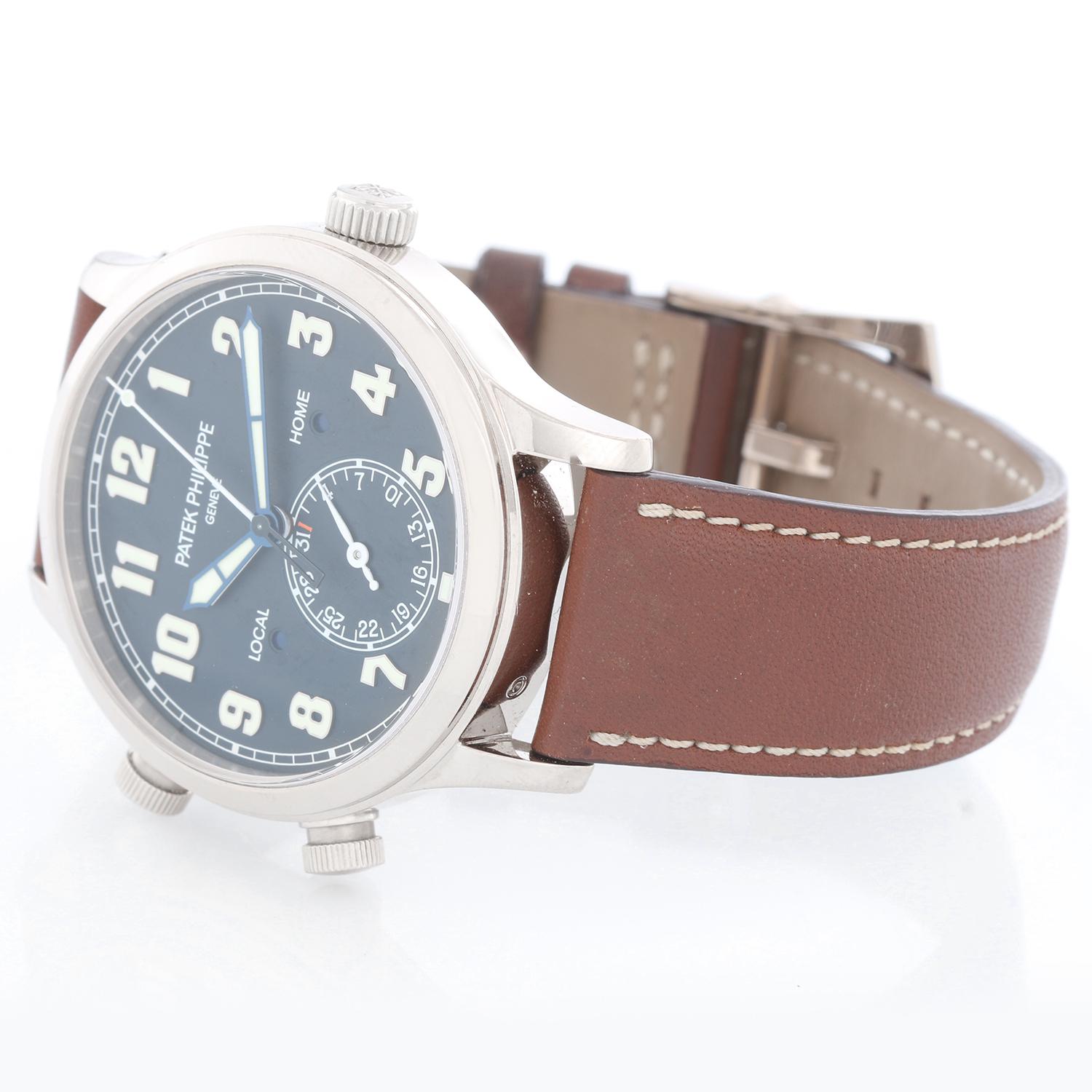 Patek Philippe Calatrava White Gold Pilot Travel Watch Ref. 5524 G - Automatic self-winding movement.. 18k White gold case (42 mm).  Exhibition sapphire crystal case back. Blue varnished dial with luminous sword-shaped hands and Arabic numeral hour