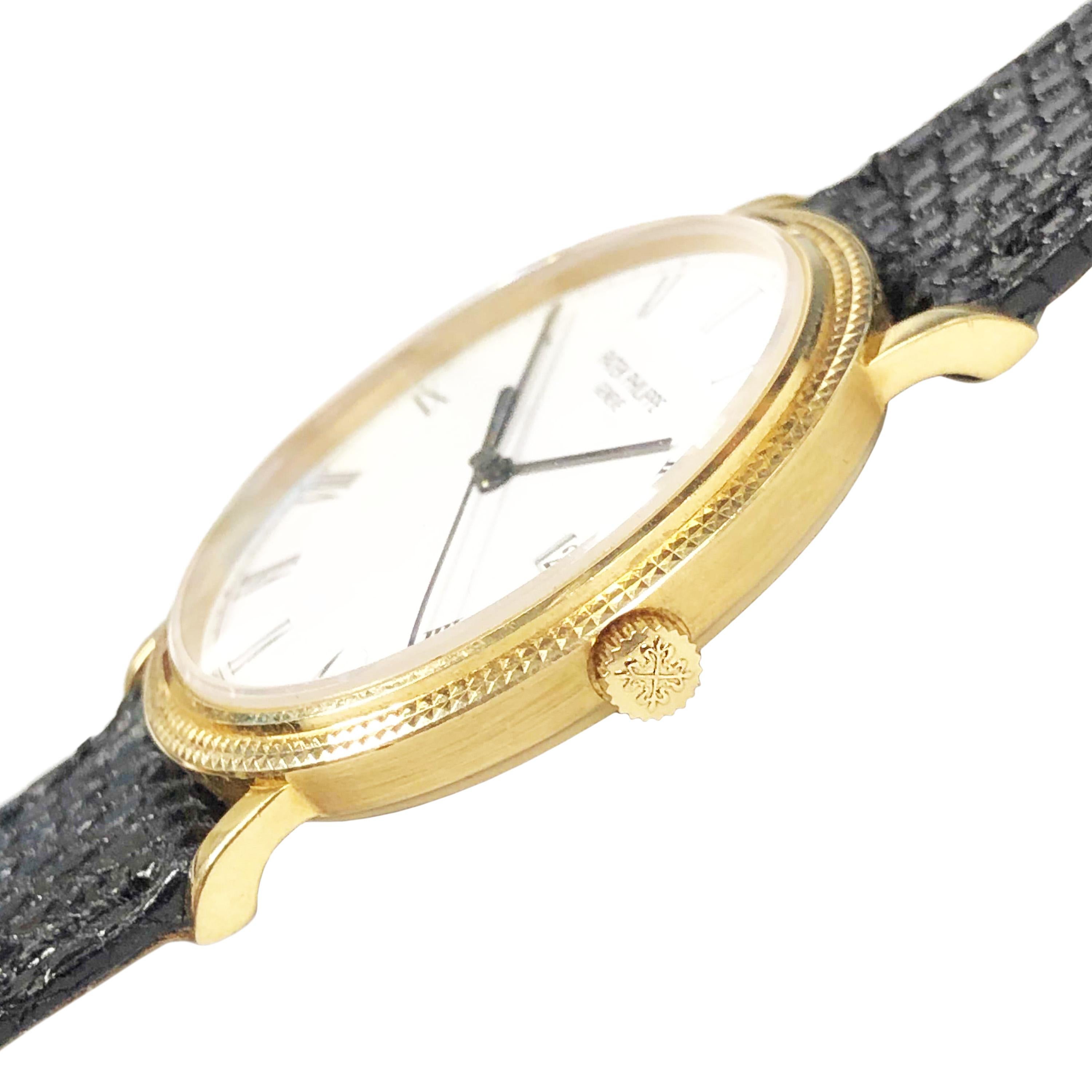 Circa 2000 Patek Philippe Reference 3944 Gents Wrist Watch, 18K Yellow Gold 33 MM 2 Piece case with Hobnail Bezel. Quartz Movement, White Dial with Black Roman Numerals, sweep seconds Hand and a Calendar window at the 3 position. New Black Lizard