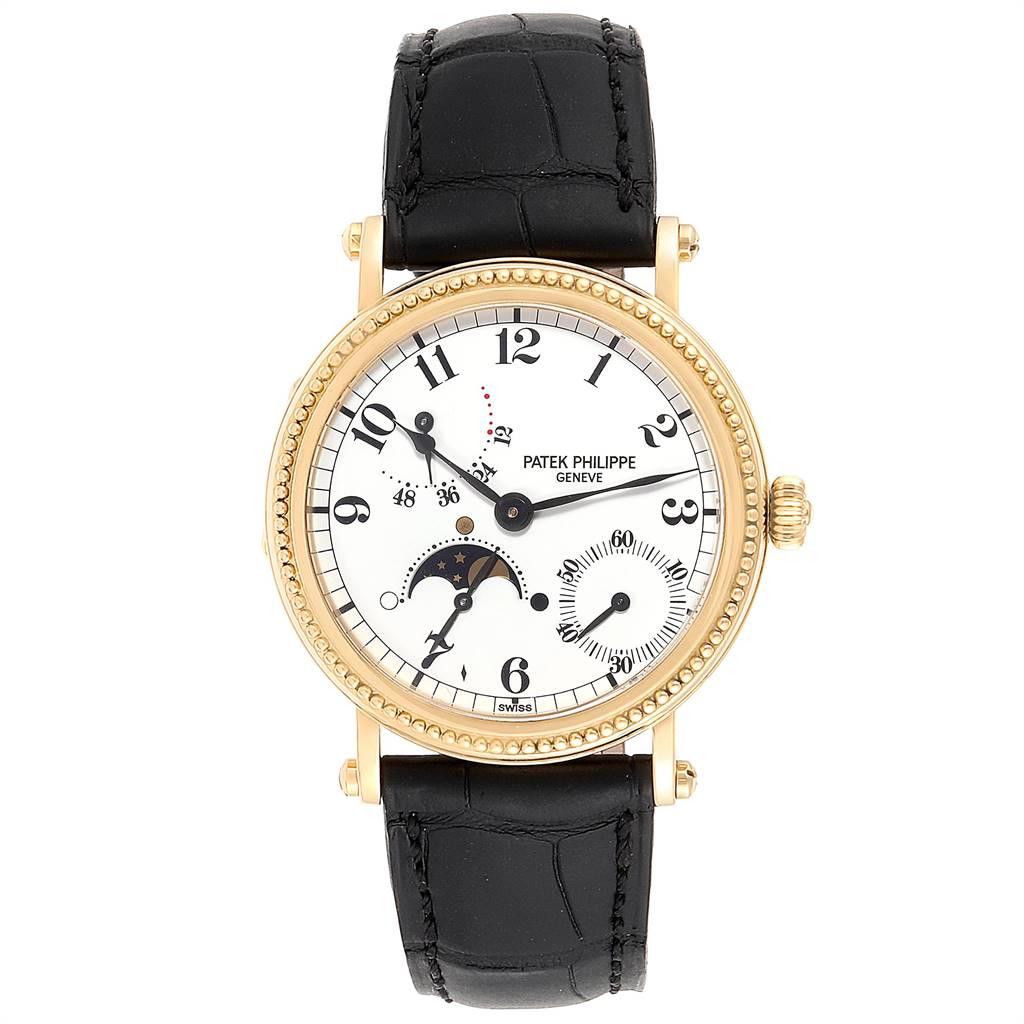 Patek Philippe Calatrava Yellow Gold Moon Phase Power Reserve Watch 5015. Automatic self-winding movement. 18k yellow gold case 35.5 mm in diameter. Hinged back, inner glazed snap on display back, screwed bar lugs. 18k yellow gold hobnail bezel.