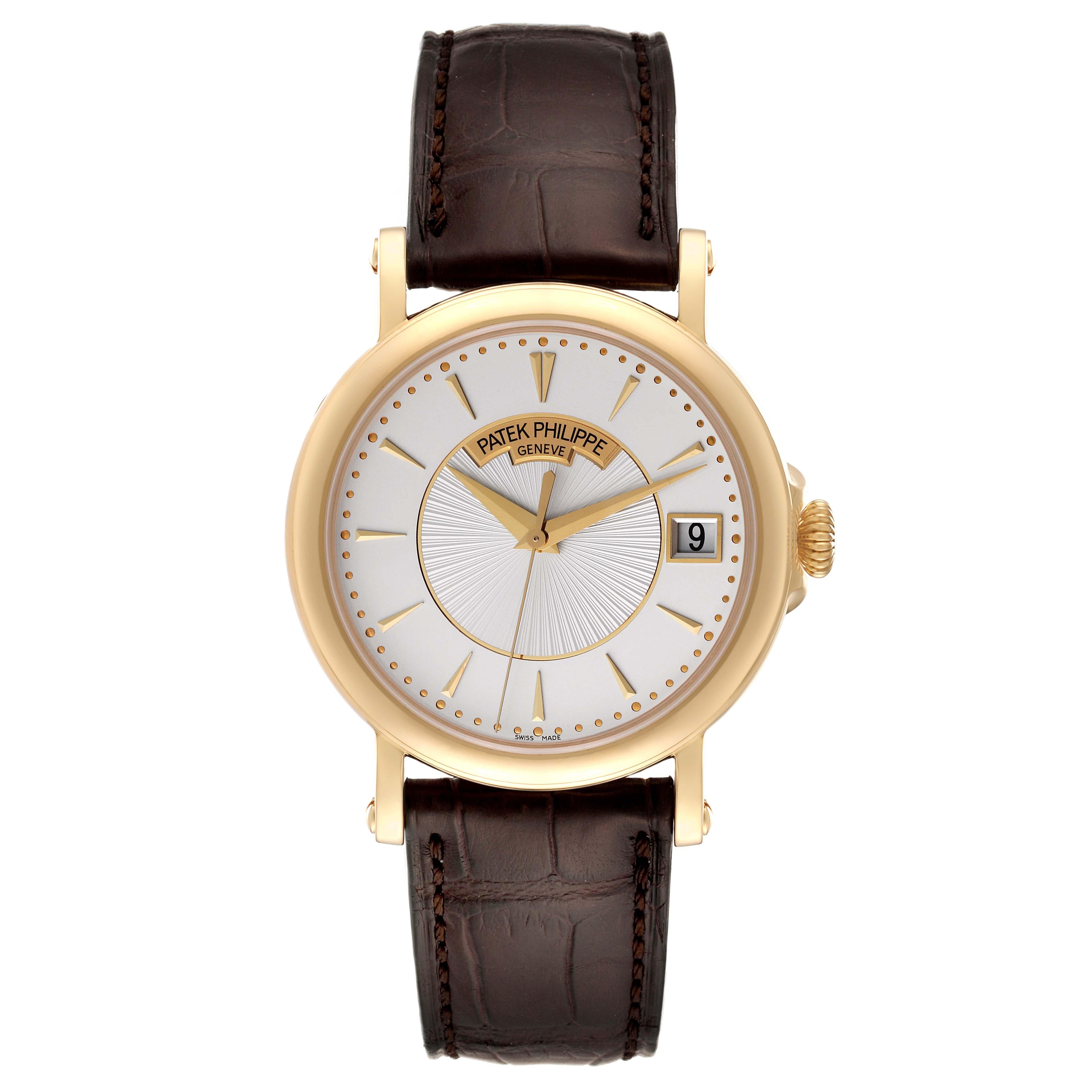 Patek Philippe Calatrava Yellow Gold Silver Dial Mens Watch 5153J Papers. Automatic self-winding movement. 18K yellow gold 38.0 mm in diameter. Hinged case back over exhibition transparent sapphire crystal to view the movement. Extended screwed