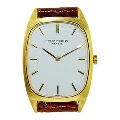 Patek Philippe & Cie 18 Karat Yellow Gold Tonneau Shaped Wrist Watch, circa 1975