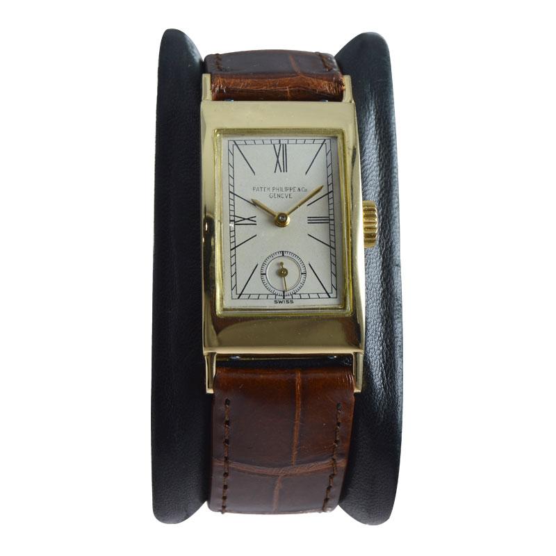 FACTORY / HOUSE: Patek Philippe & Cie.
STYLE / REFERENCE: Art Deco / Tank Style / Ref. 424
METAL / MATERIAL: 18Kt. Yellow Gold
CIRCA / YEAR: 1940's
DIMENSIONS / SIZE: 42mm X 20mm
MOVEMENT / CALIBER: Manual Winding / 18 Jewels / 9/90
DIAL / HANDS: