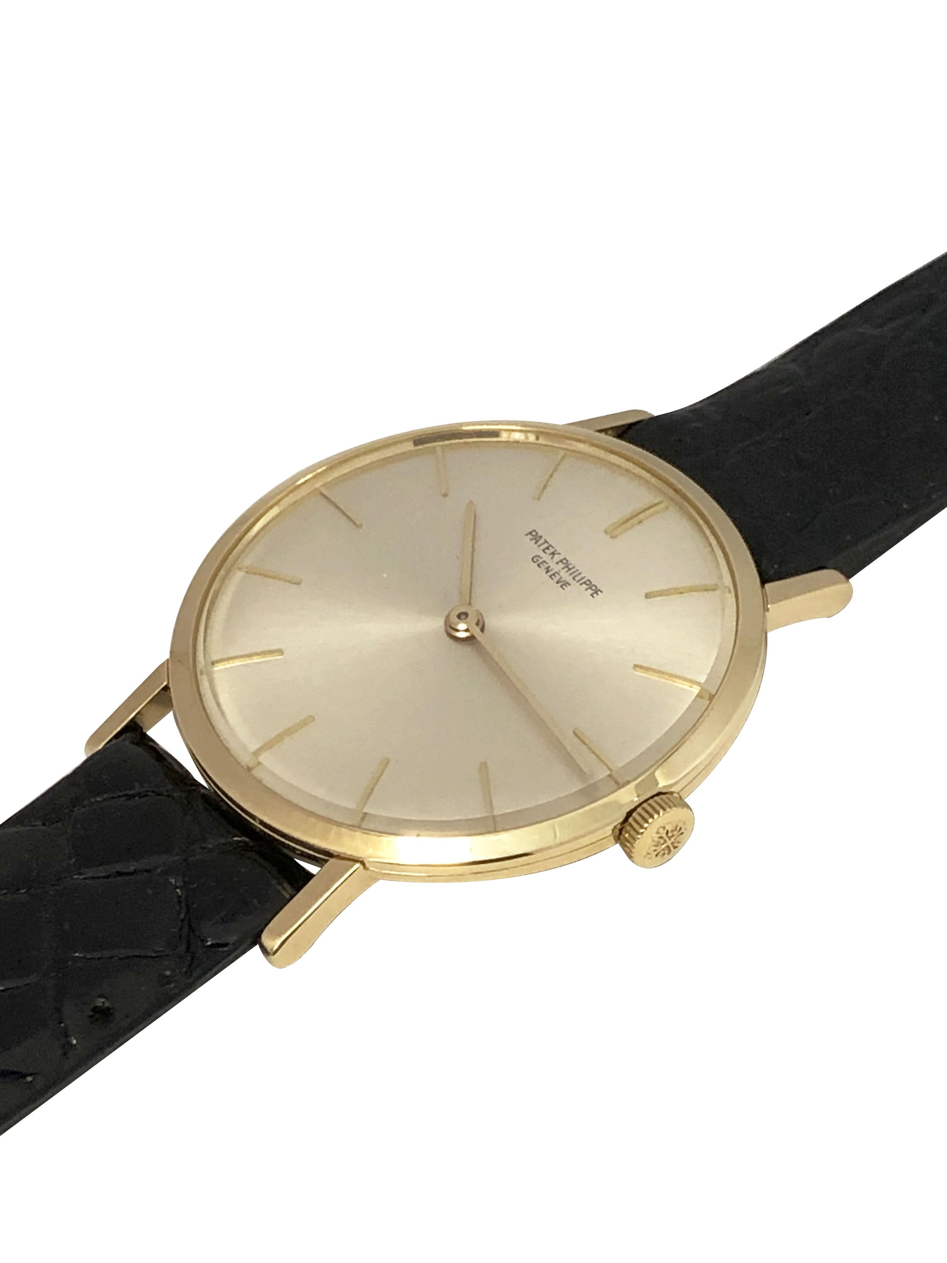 Circa 1960s Patek Philippe Reference 3537 Wrist Watch, 33 M.M. 3 Piece 18k Yellow Gold case, 7 M.M. thick. 18 Jewel caliber 23-300 Mechanical, manual wind movement. Beautiful mint silver satin dial with raised gold markers, glass crystal, Patek logo