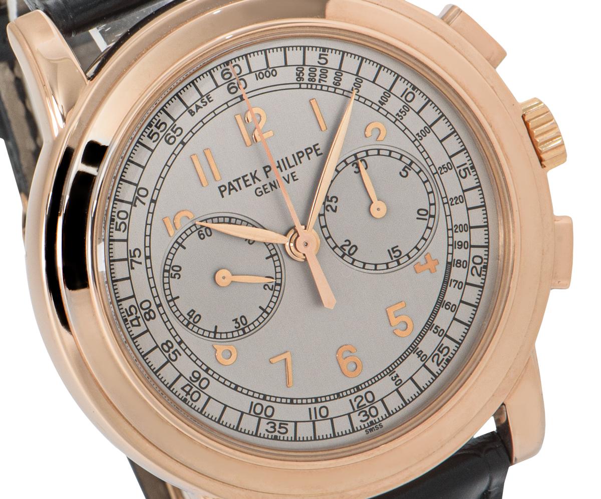 A stunning men's Classic Chronograph wristwatch, crafted in rose gold by Patek Philippe. Featuring a silver dial, applied arabic numbers with a tachymeter scale, a minute track on the outer dial and two sub dials; 30minute recorder and small